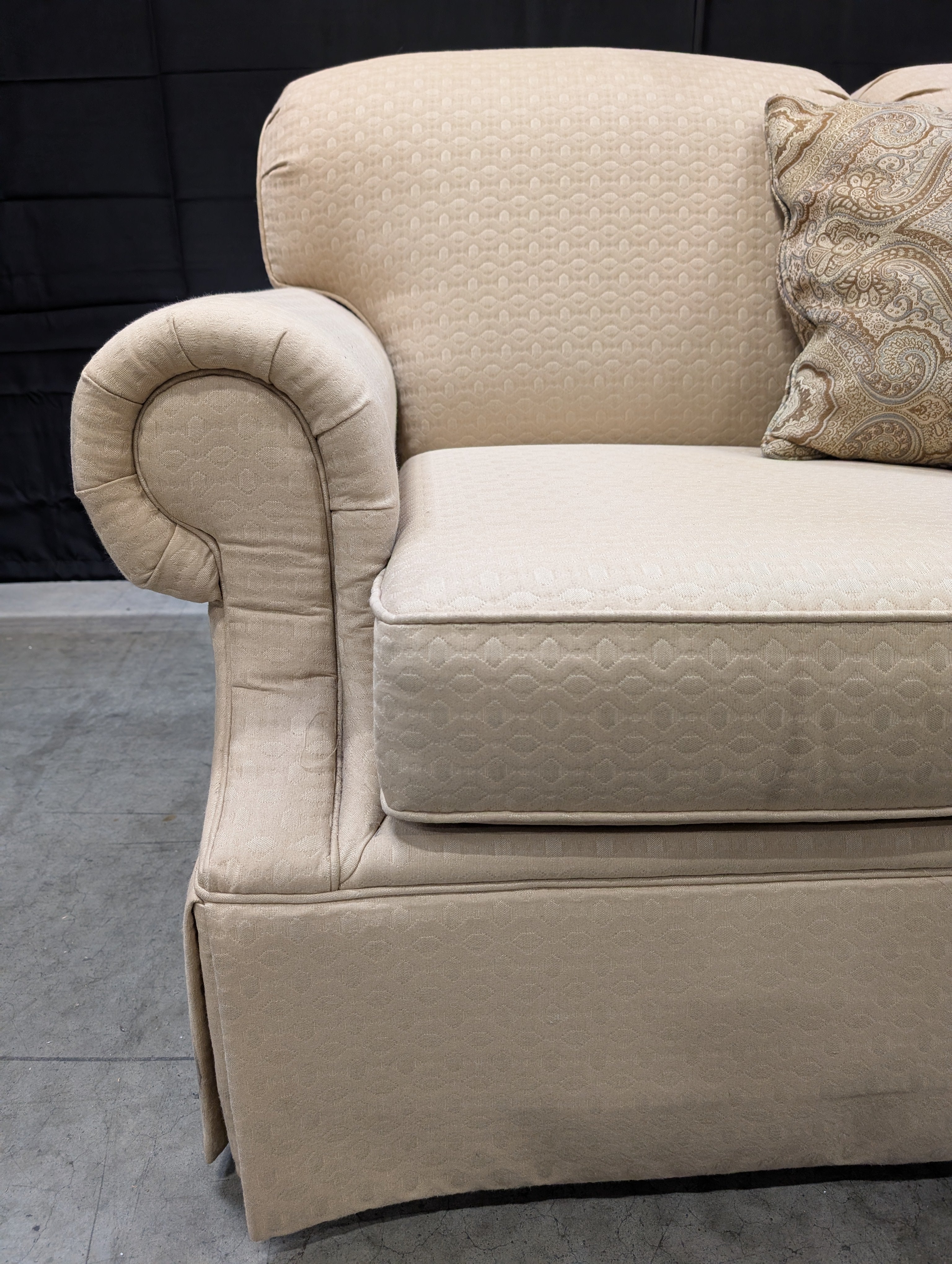 Classic Tan Two-Seater Sofa with Rolled Arms