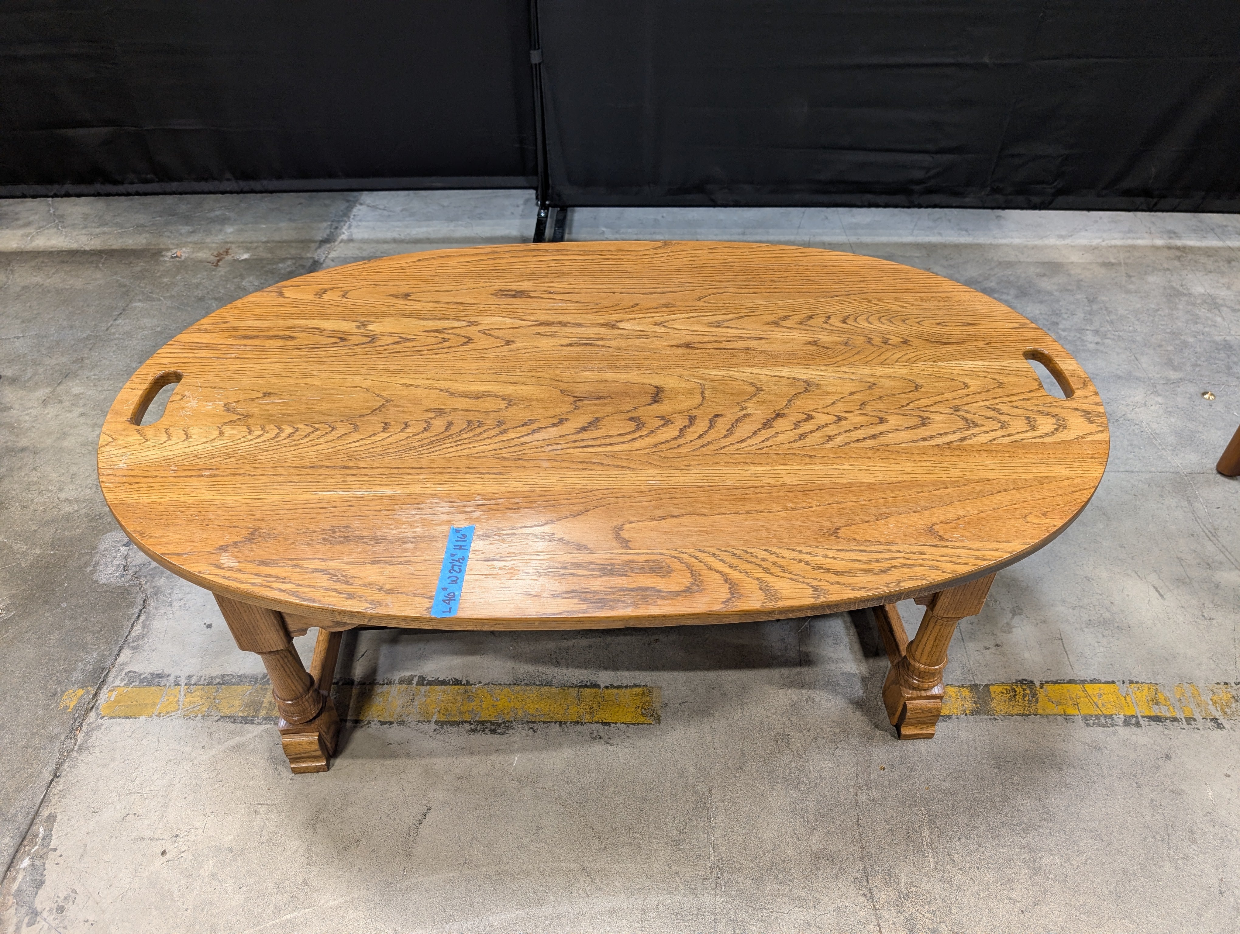 Oval Light Brown Wood Coffee Table with Cut-Out Handles
