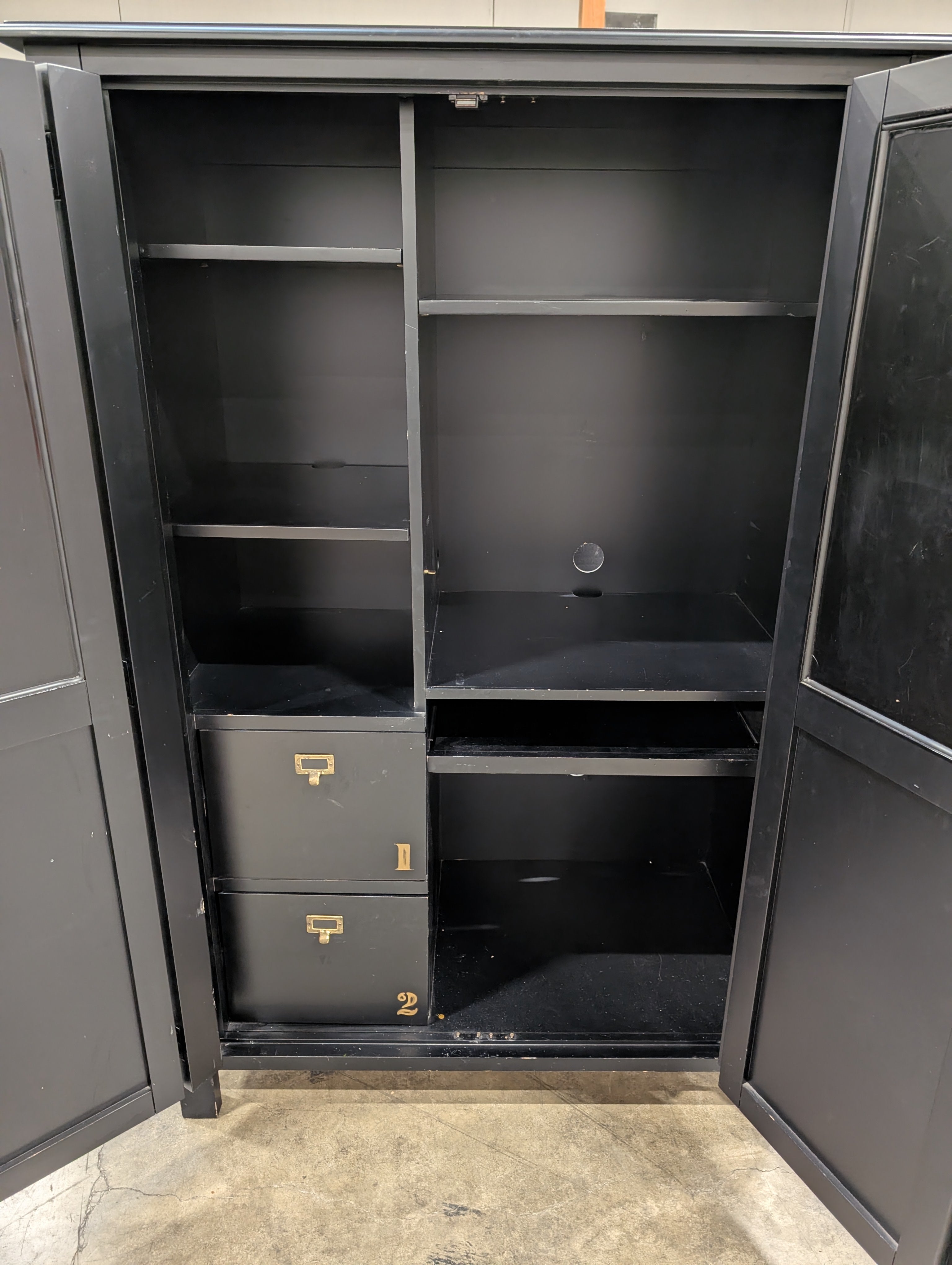 Versatile Black Wood Storage Armoire with Paneled Doors