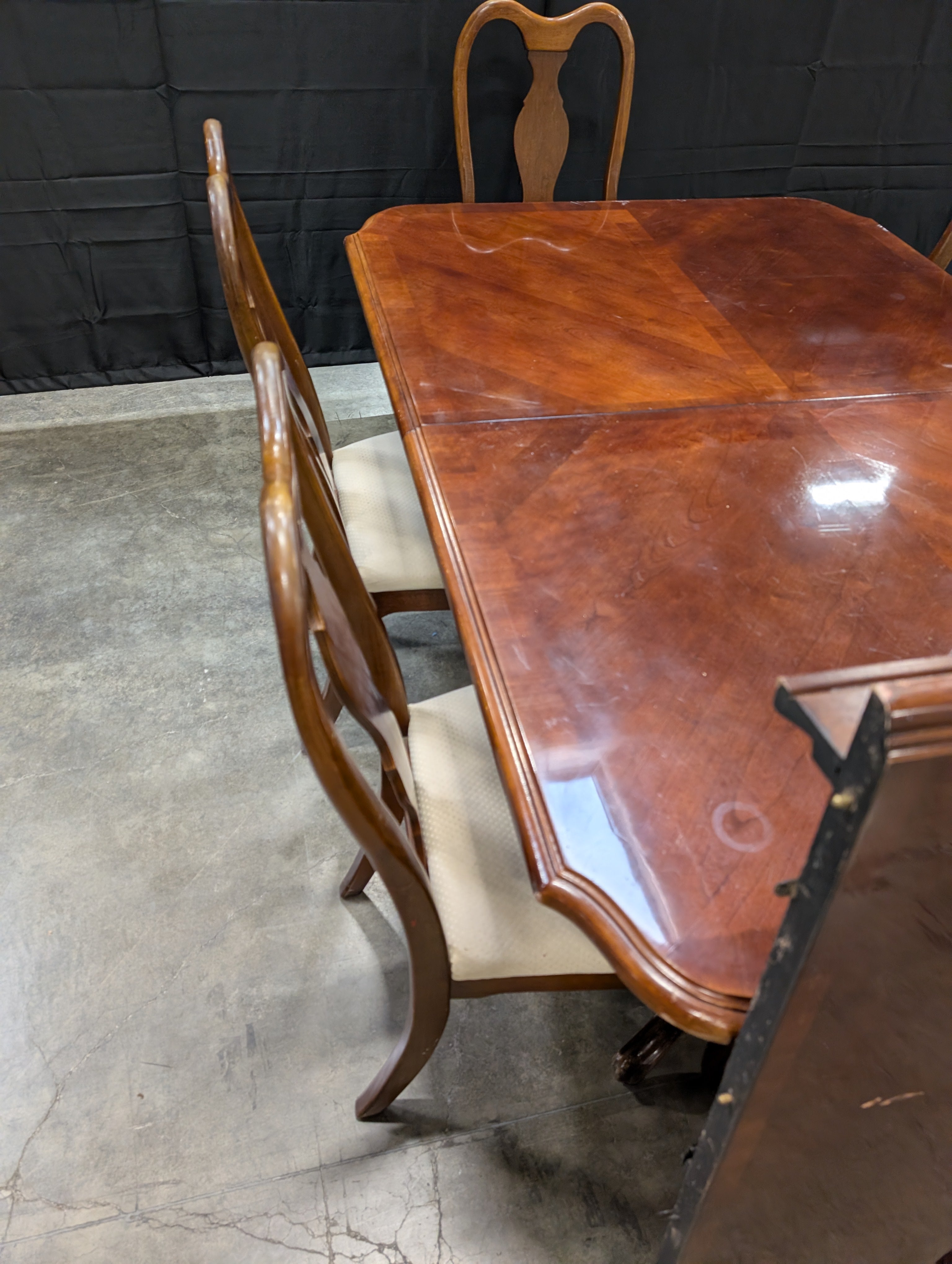 Traditional Dark Wood Dining Table with Six Shaped-Back Chairs