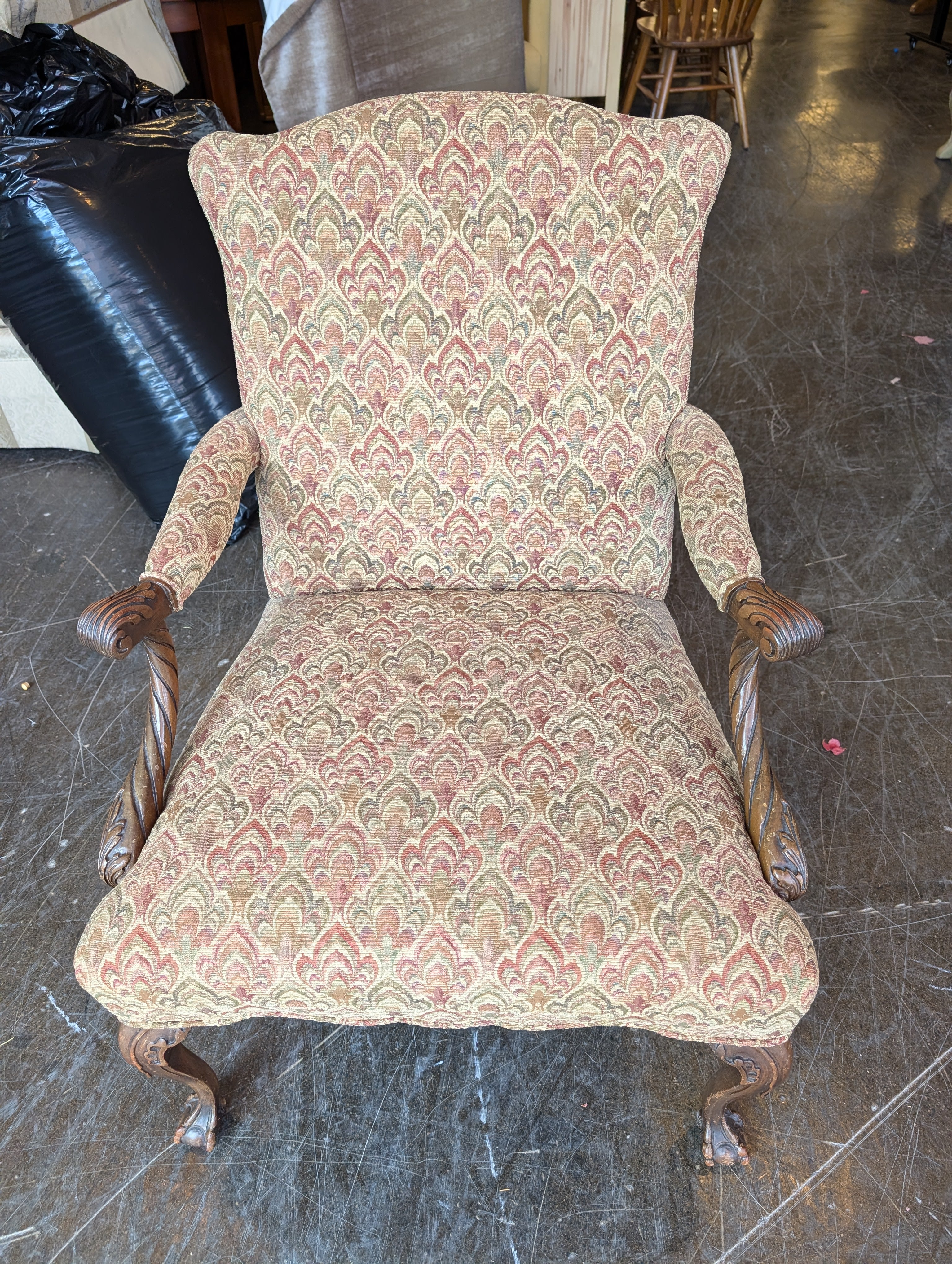 Traditional Upholstered Armchair with Carved Wood Accents