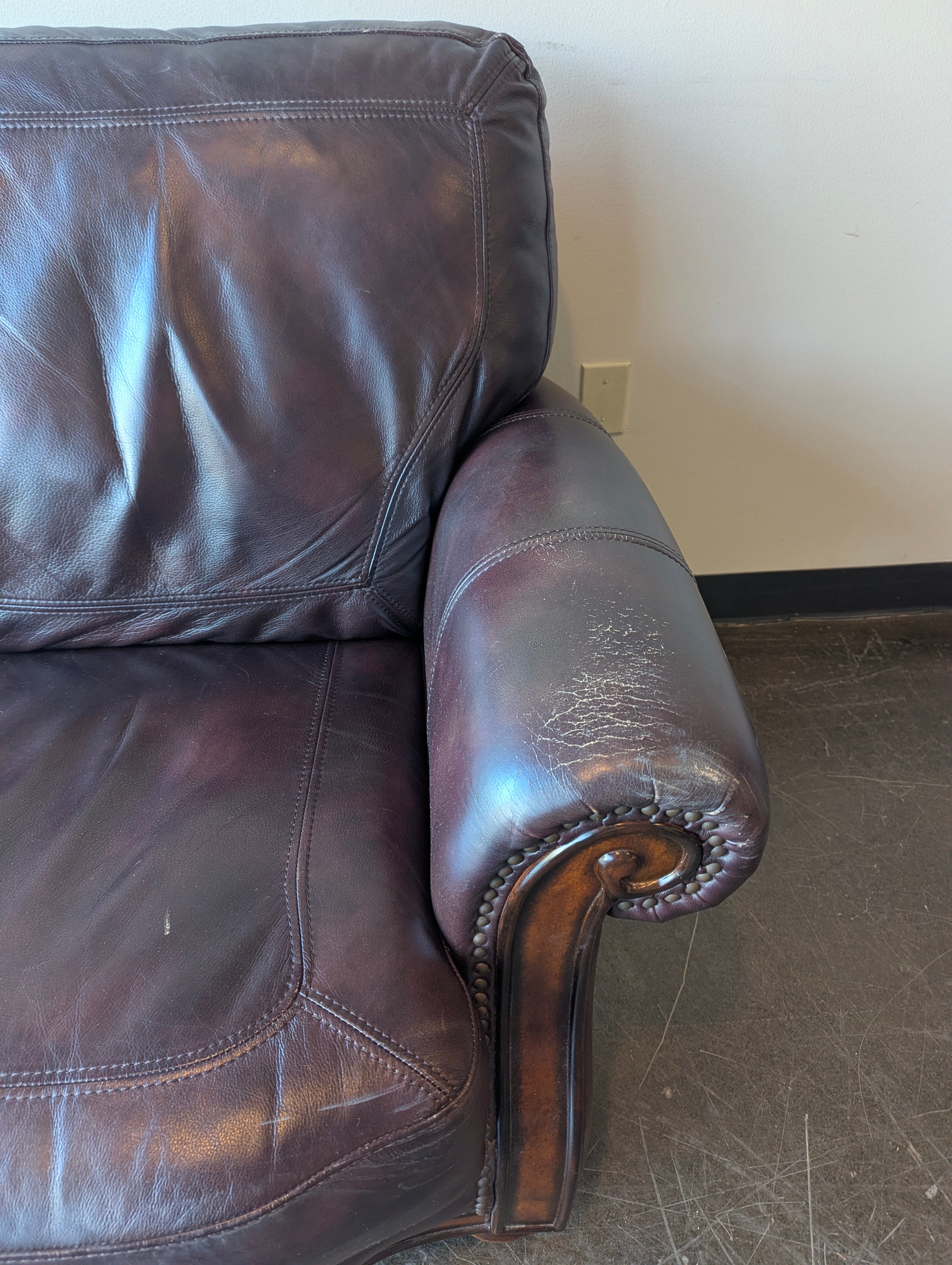 Classic Burgundy Leather Three-Seater Sofa with Rolled Arms