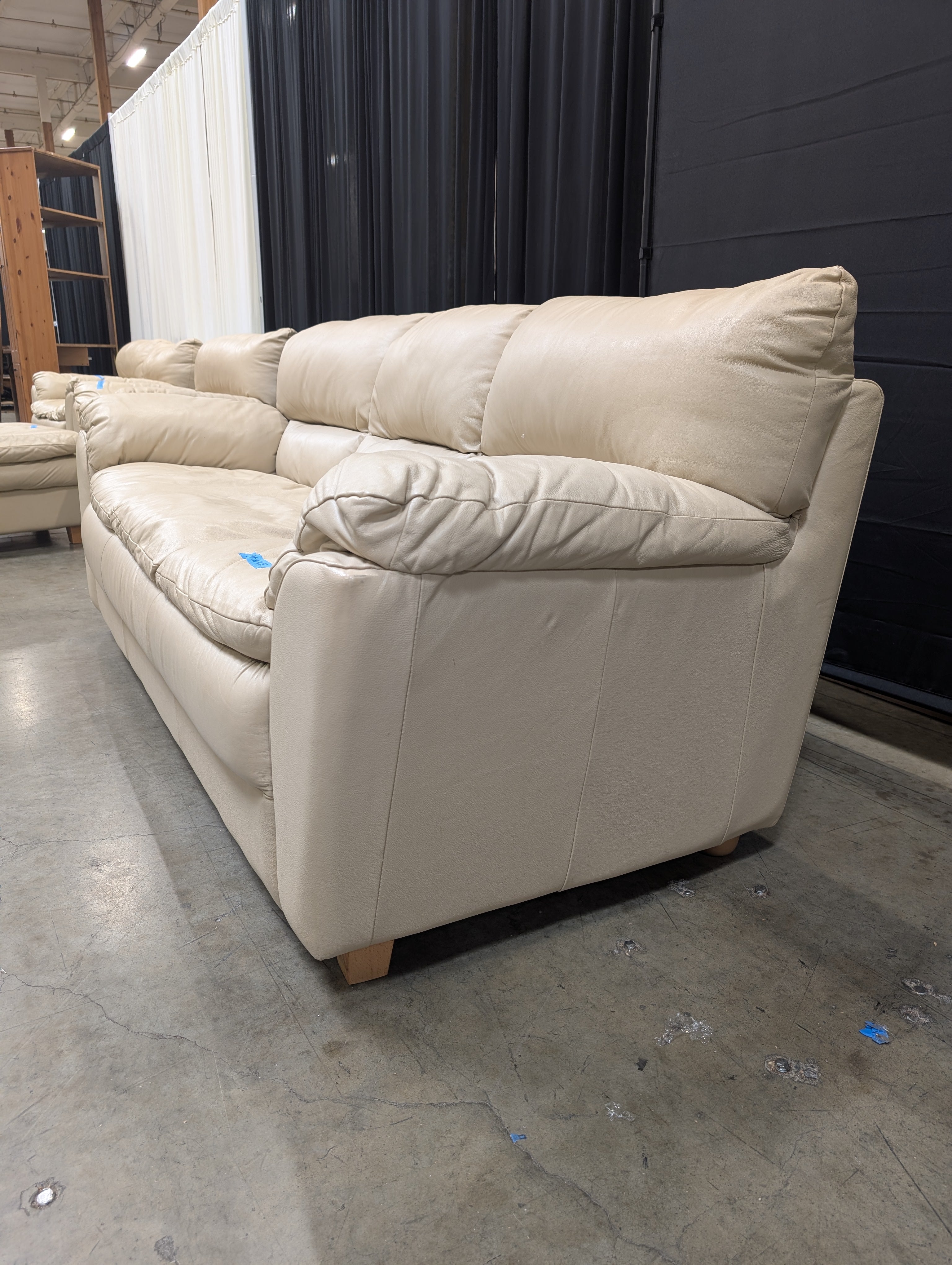 Cream Three-Seat Leather Couch with Pillow Arms
