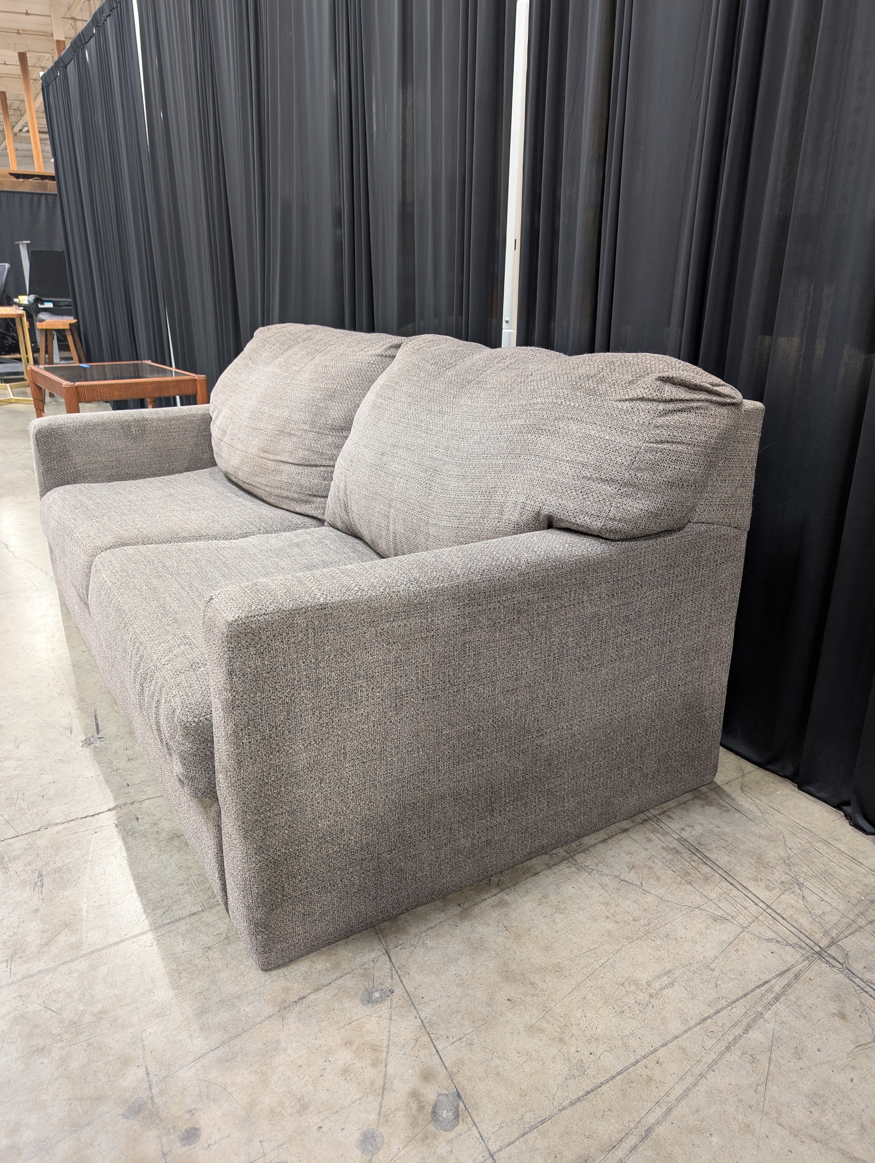 Grey Textured Fabric Two-Seater Couch with Track Arms