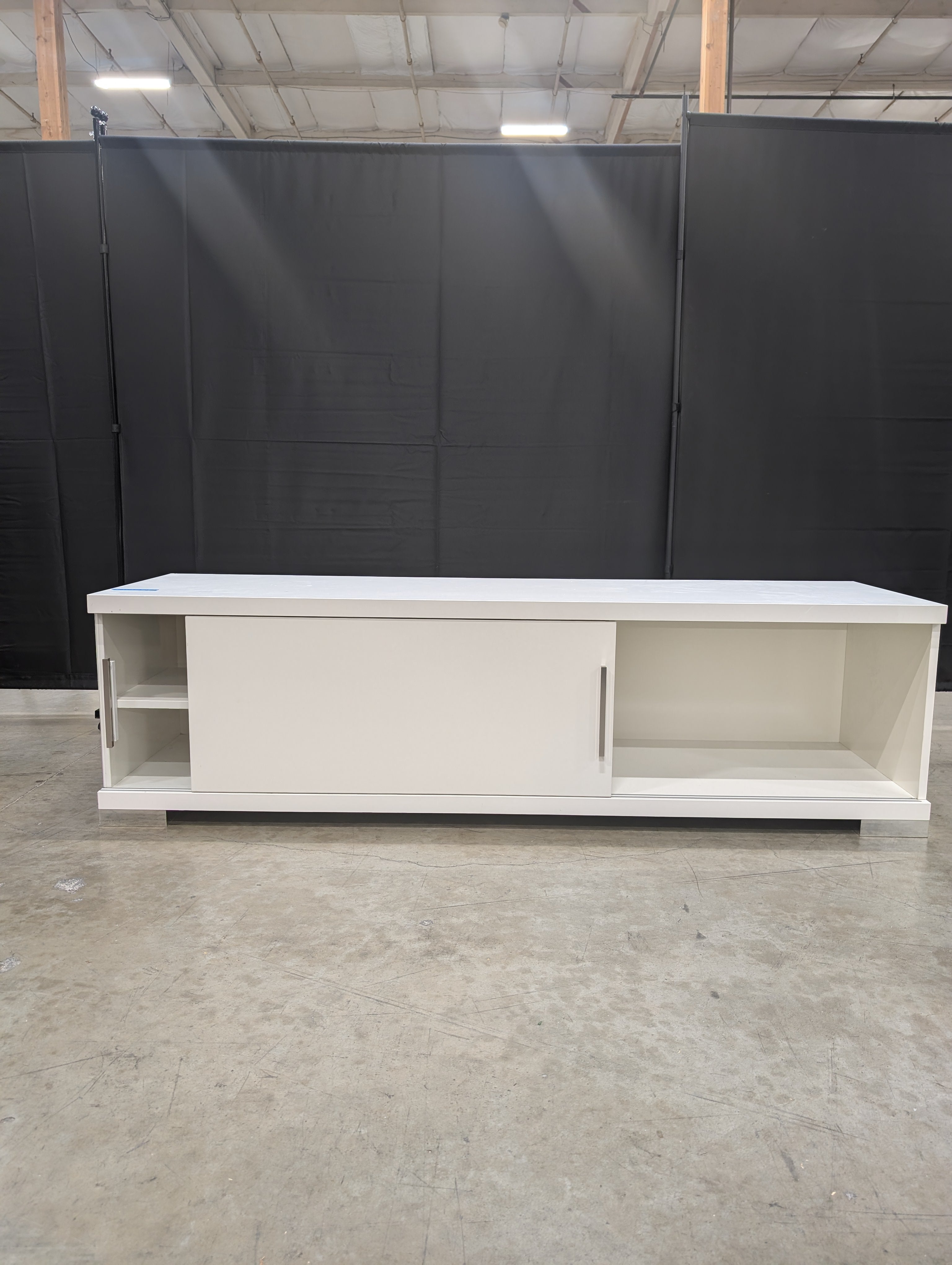 Sleek White Entertainment Unit with Sliding Doors