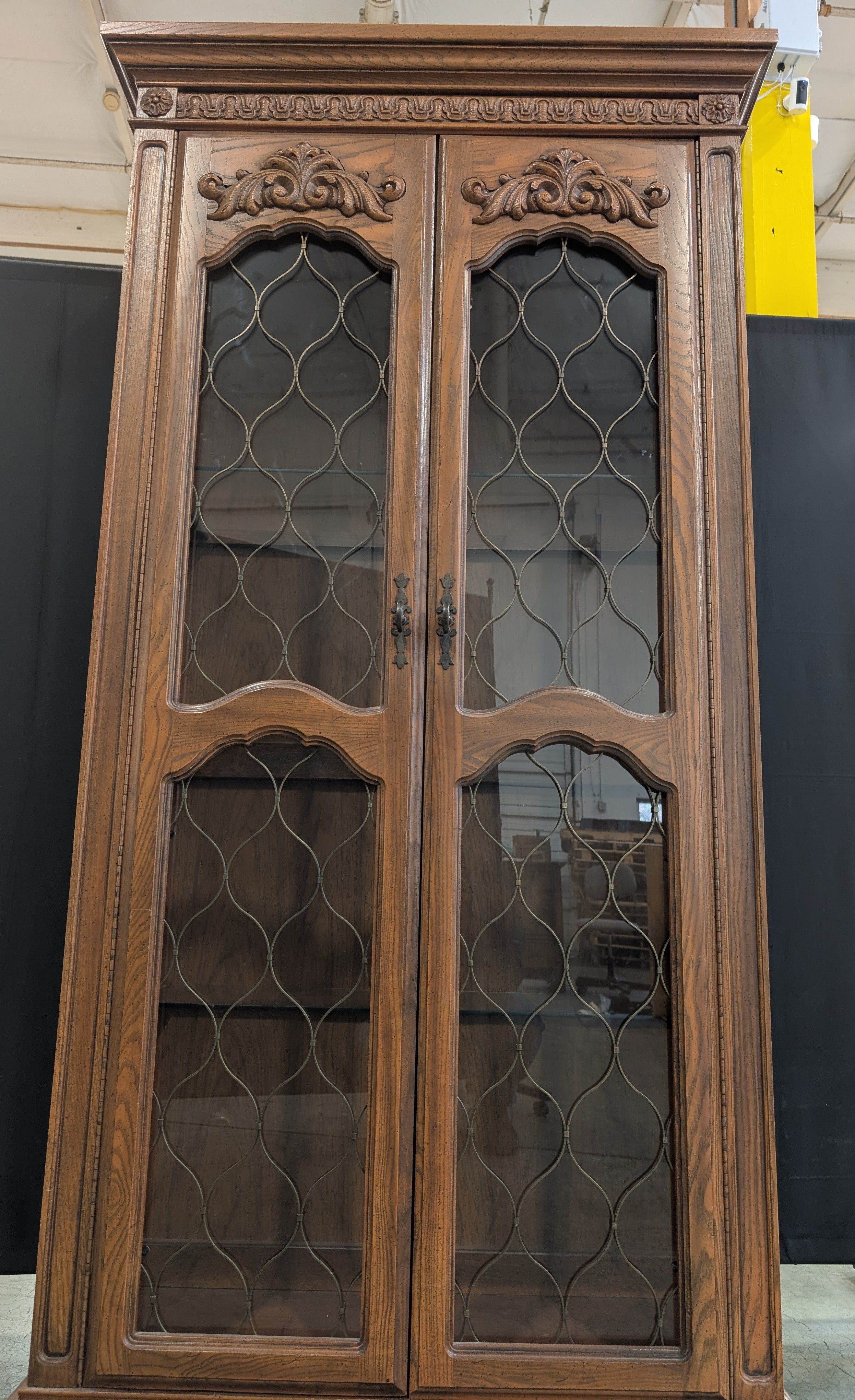 Ornate Wood Display Cabinet with Leaded Glass Doors