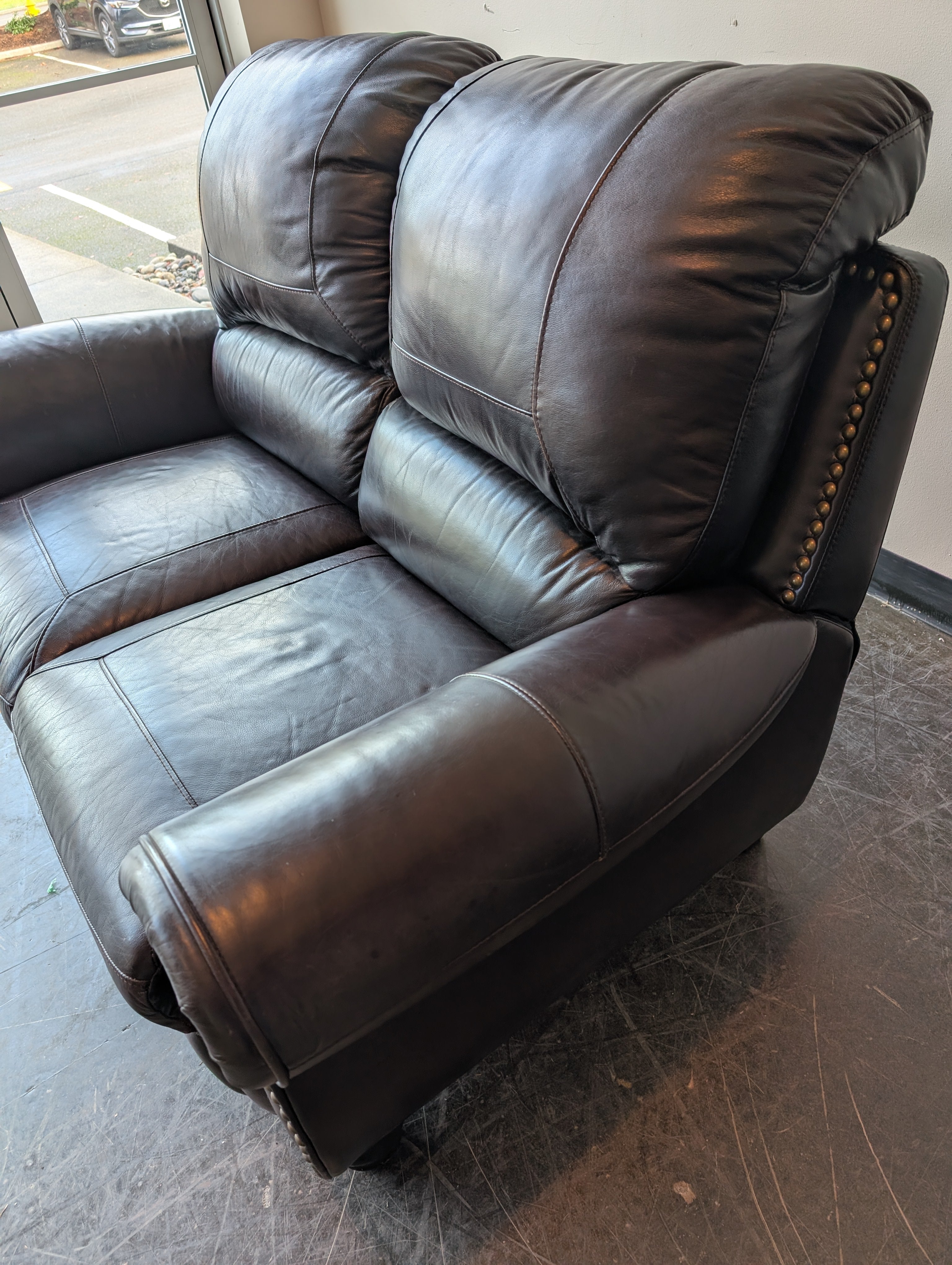 Classic Dark Brown Leather Reclining Loveseat with Nailhead Trim