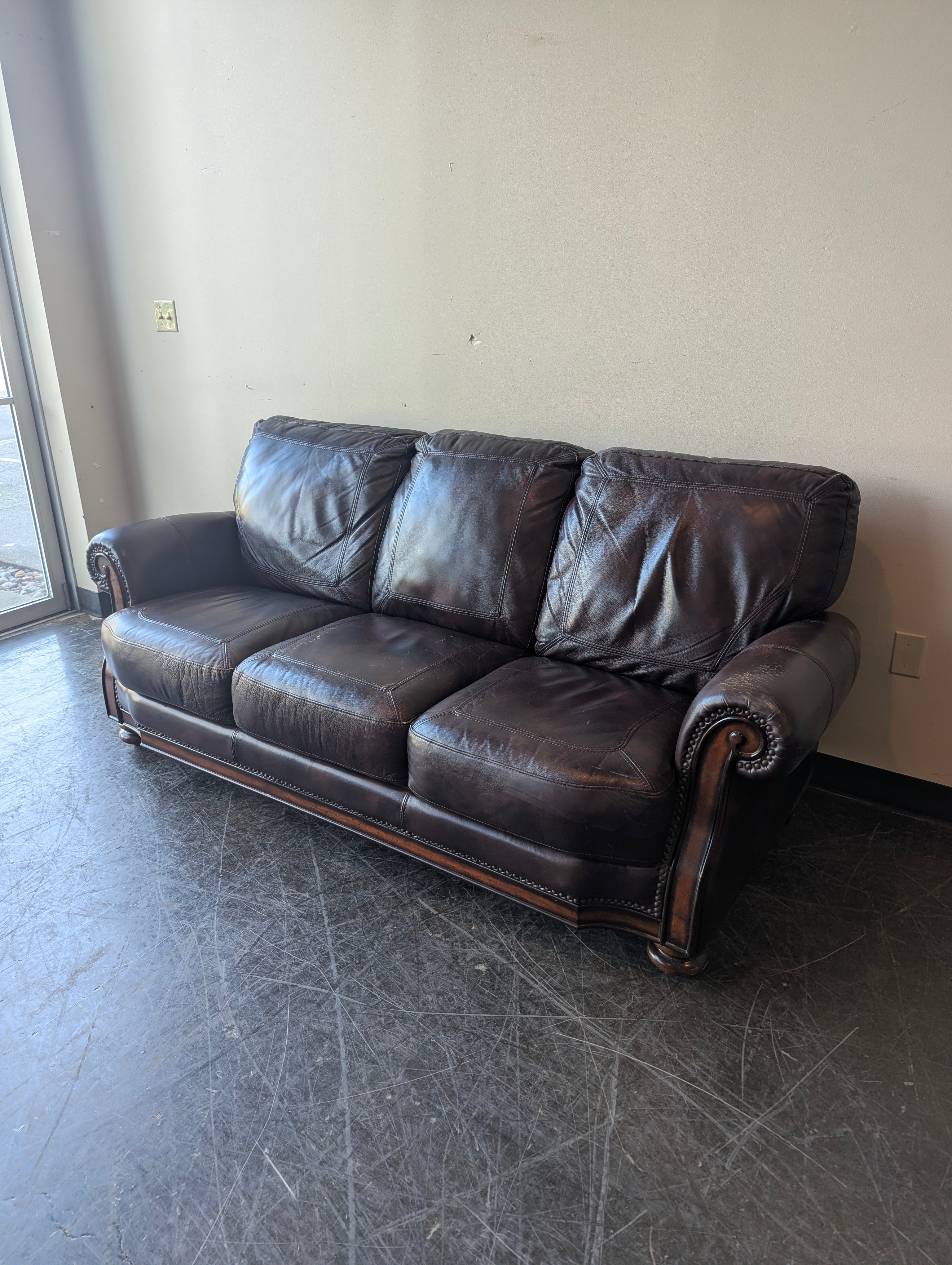 Classic Burgundy Leather Three-Seater Sofa with Rolled Arms