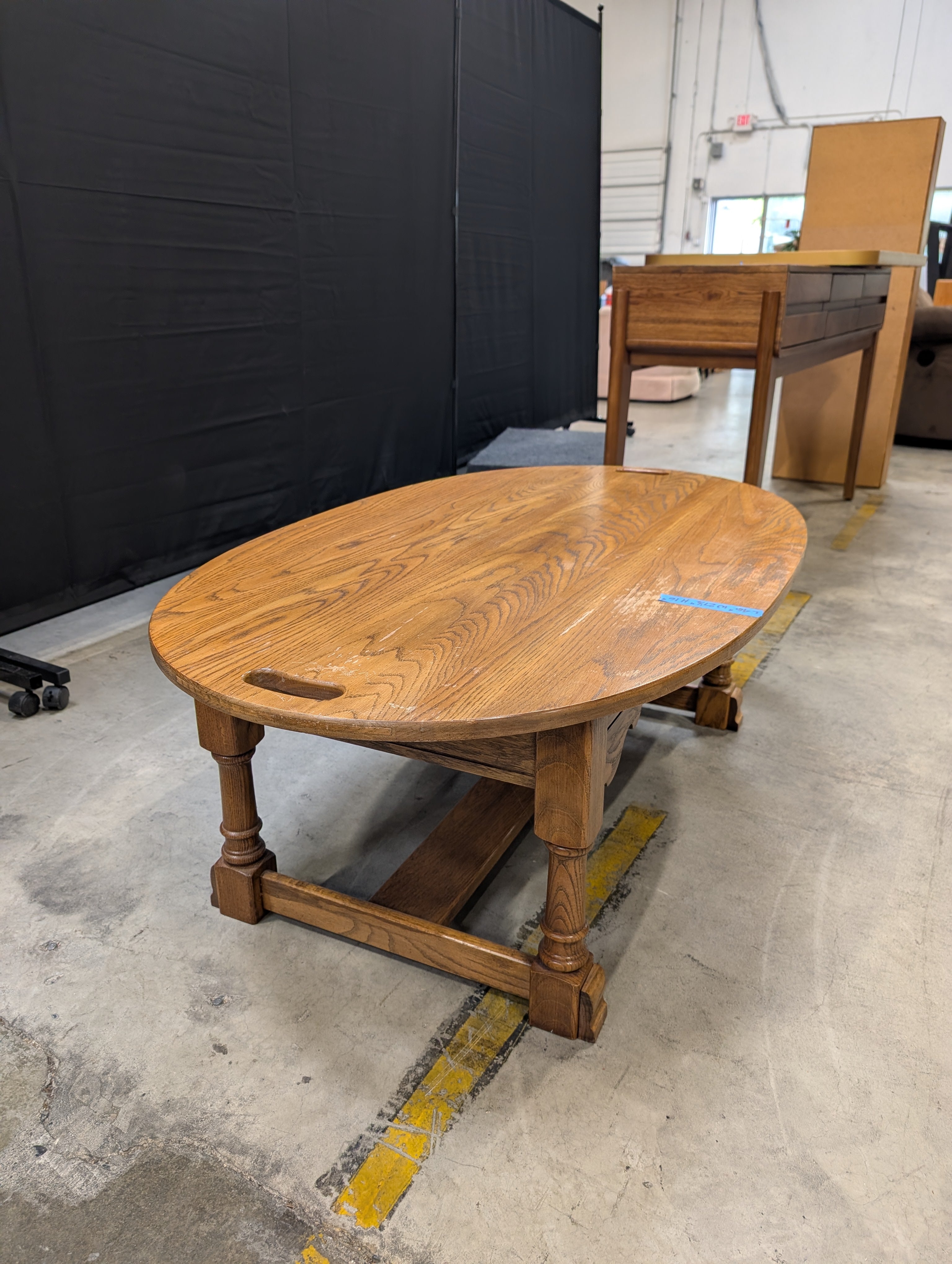 Oval Light Brown Wood Coffee Table with Cut-Out Handles