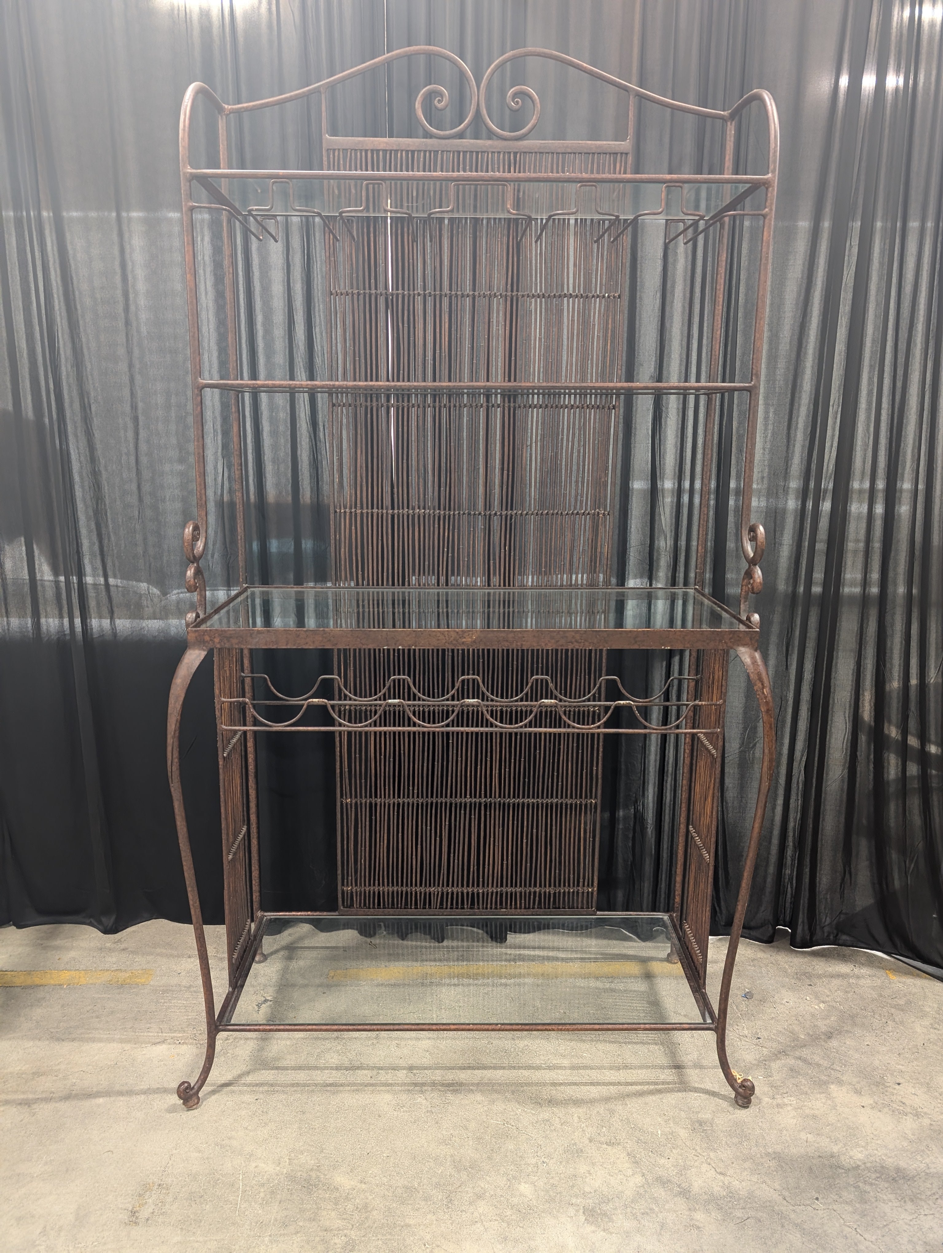 Ornate Dark Metal Baker's Rack with Woven Back