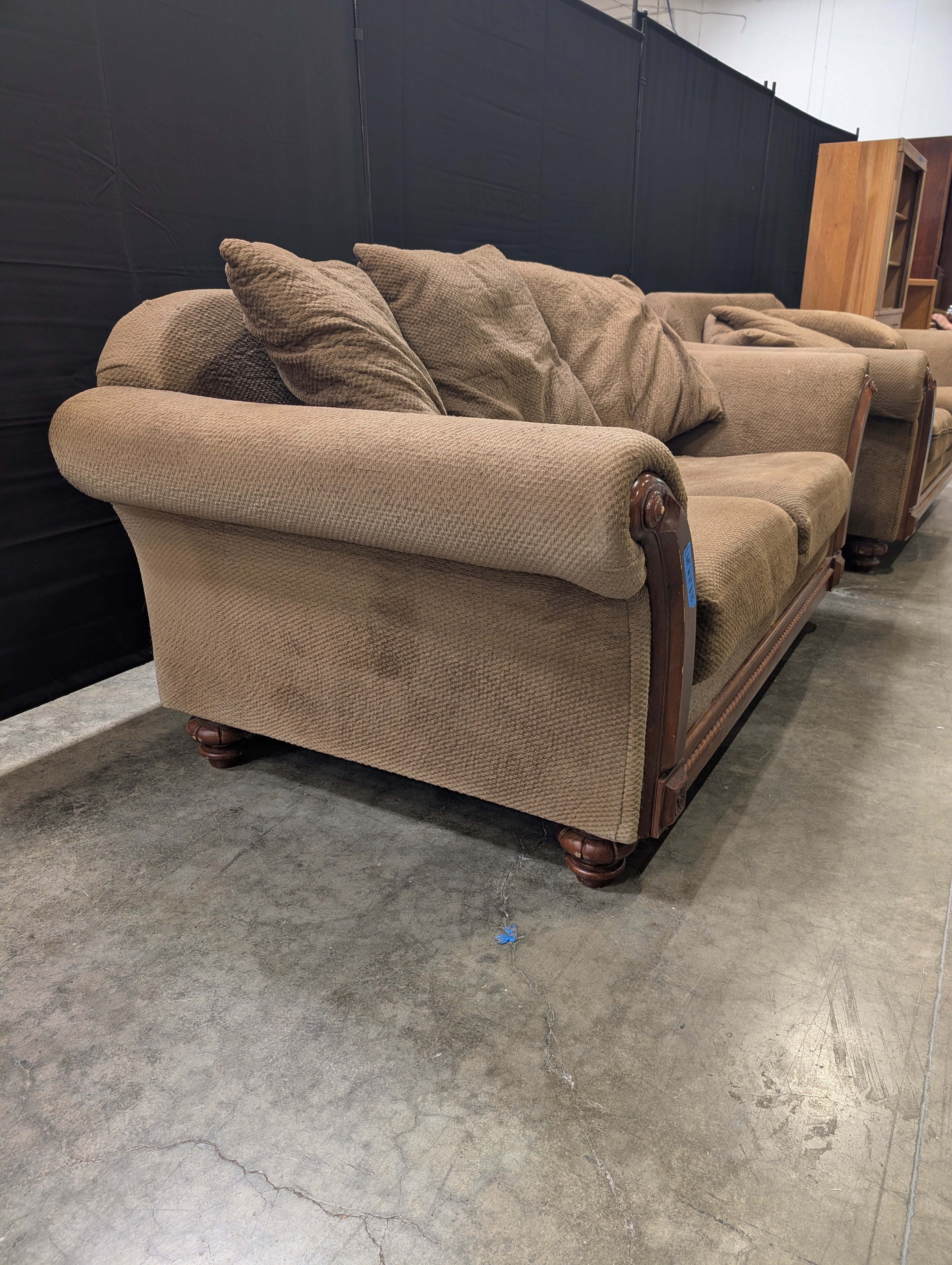 Brown Textured Fabric Loveseat with Wood Trim