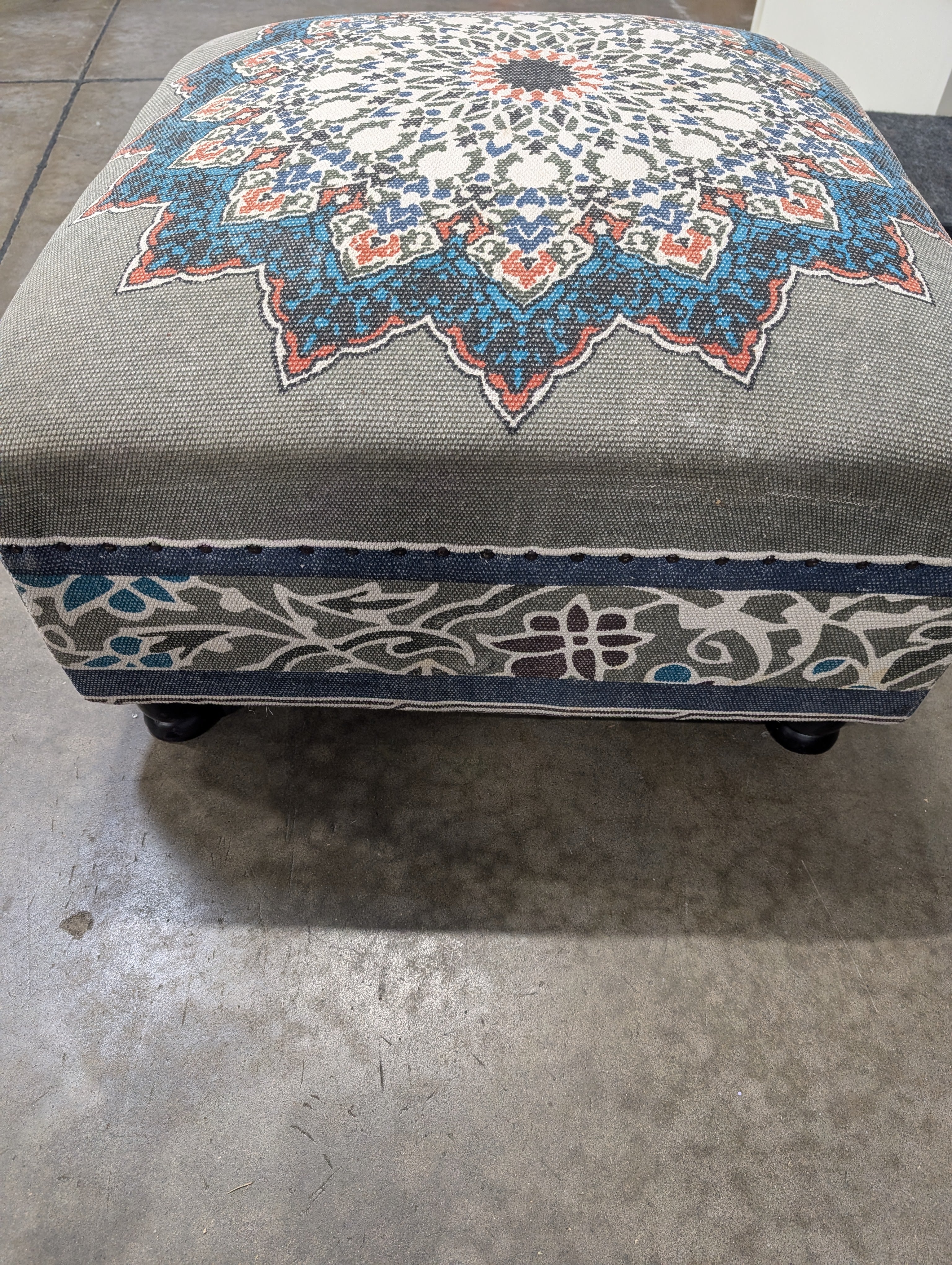 Decorative Upholstered Ottoman with Medallion Pattern and Nailhead Trim