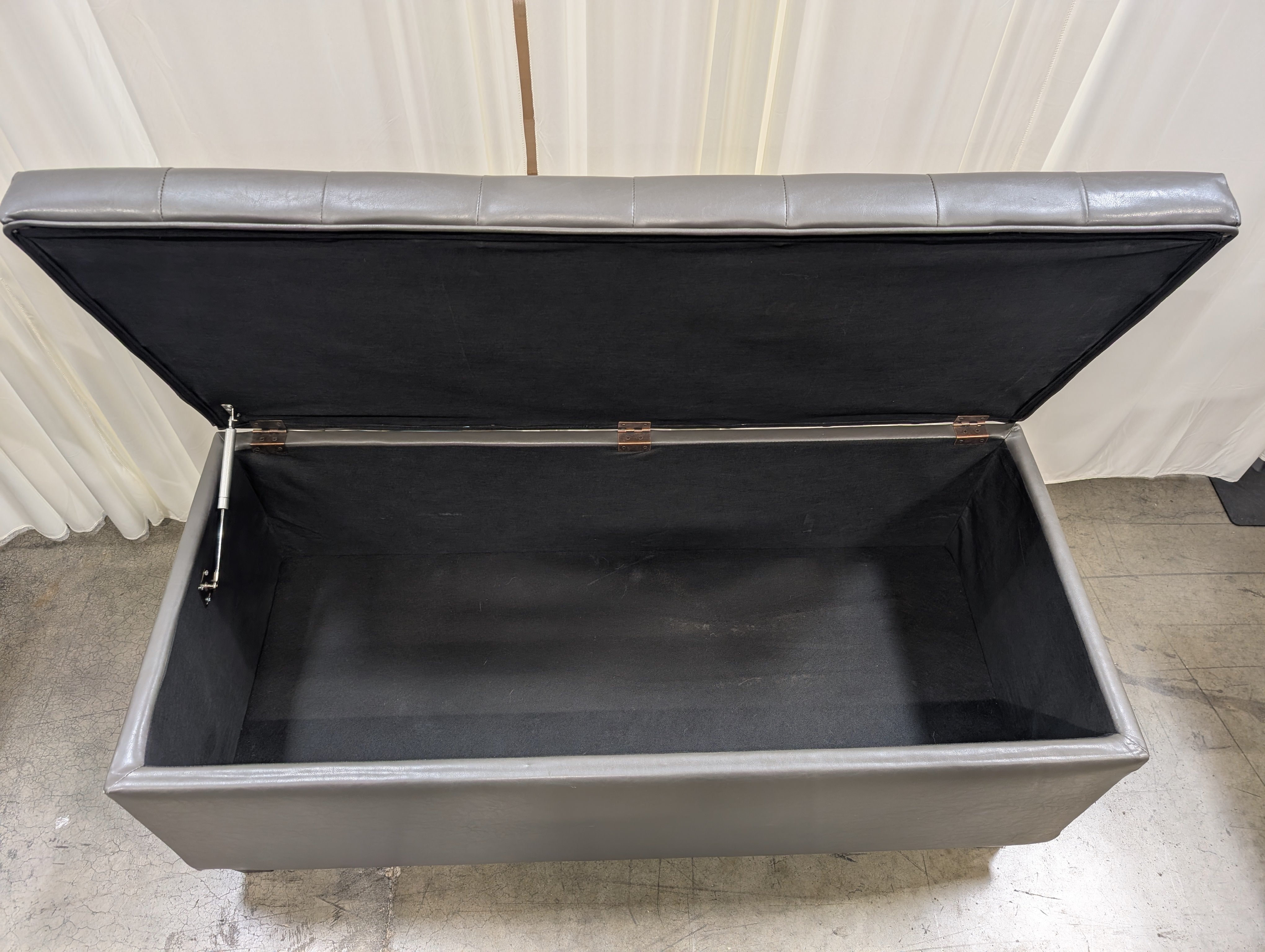 Charcoal Tufted Storage Ottoman in Faux Leather