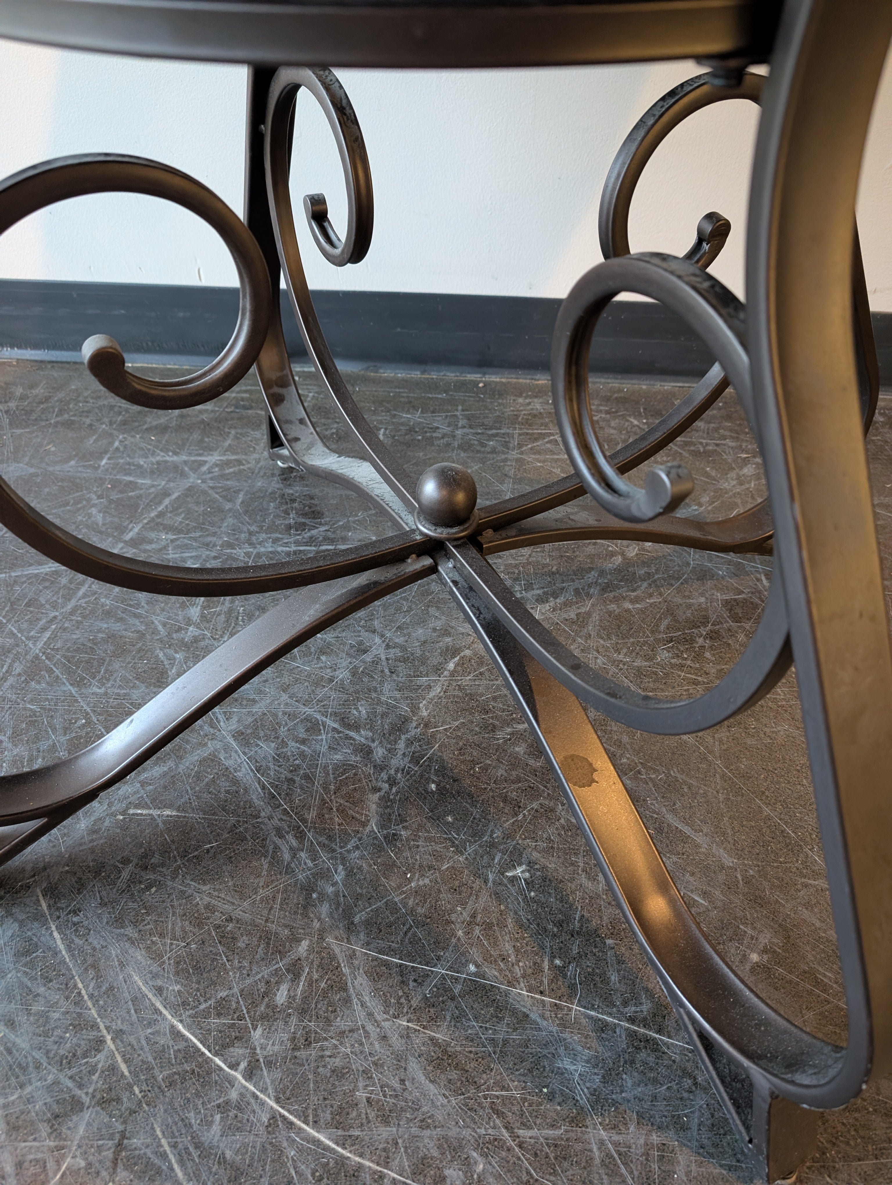 Round Stone Top Dining Table with Wood Trim and Metal Pedestal Base