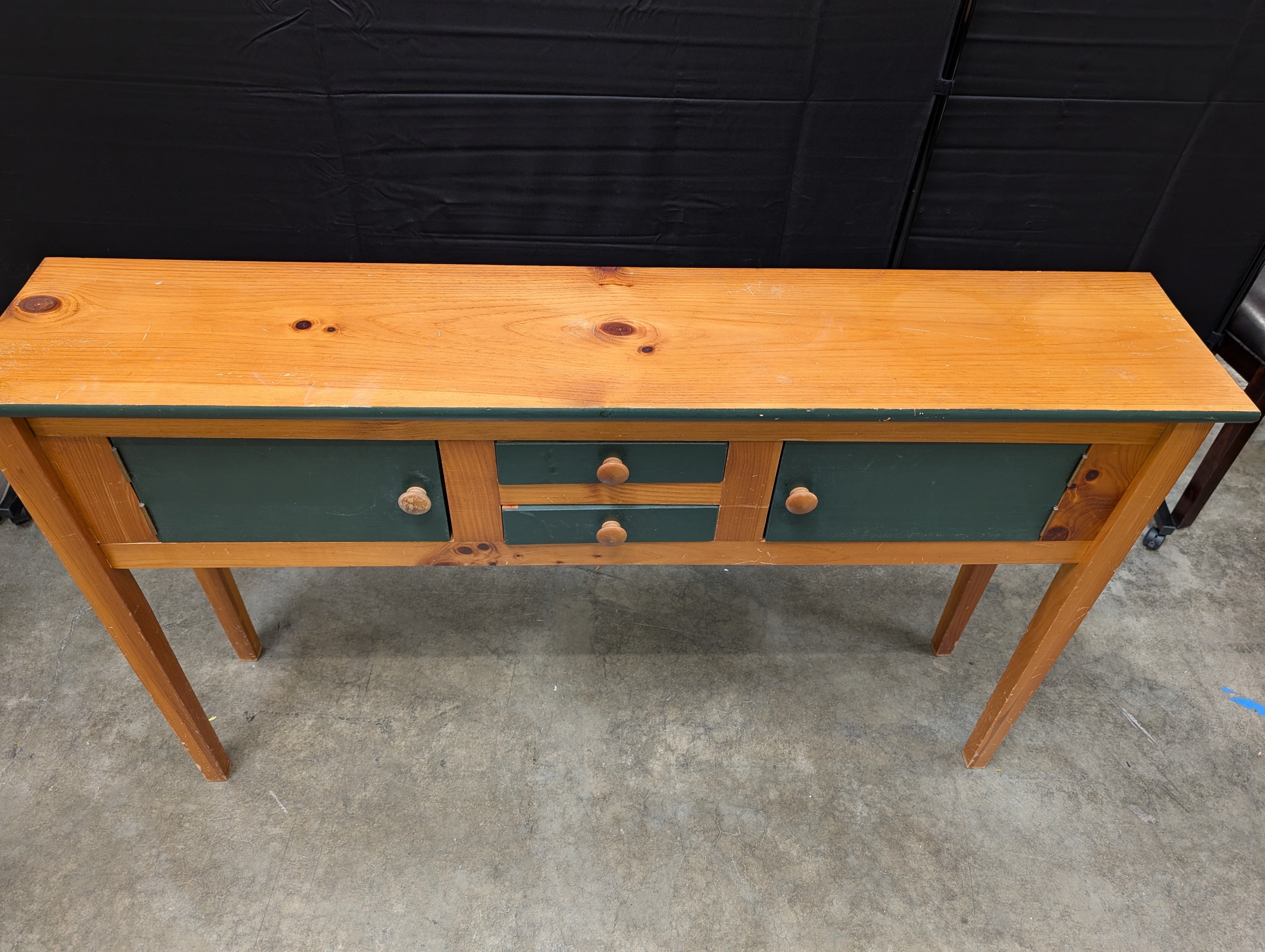 Rustic Wood Console Table with Dark Green Cabinetry