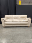 Cream Three-Seat Leather Couch with Pillow Arms