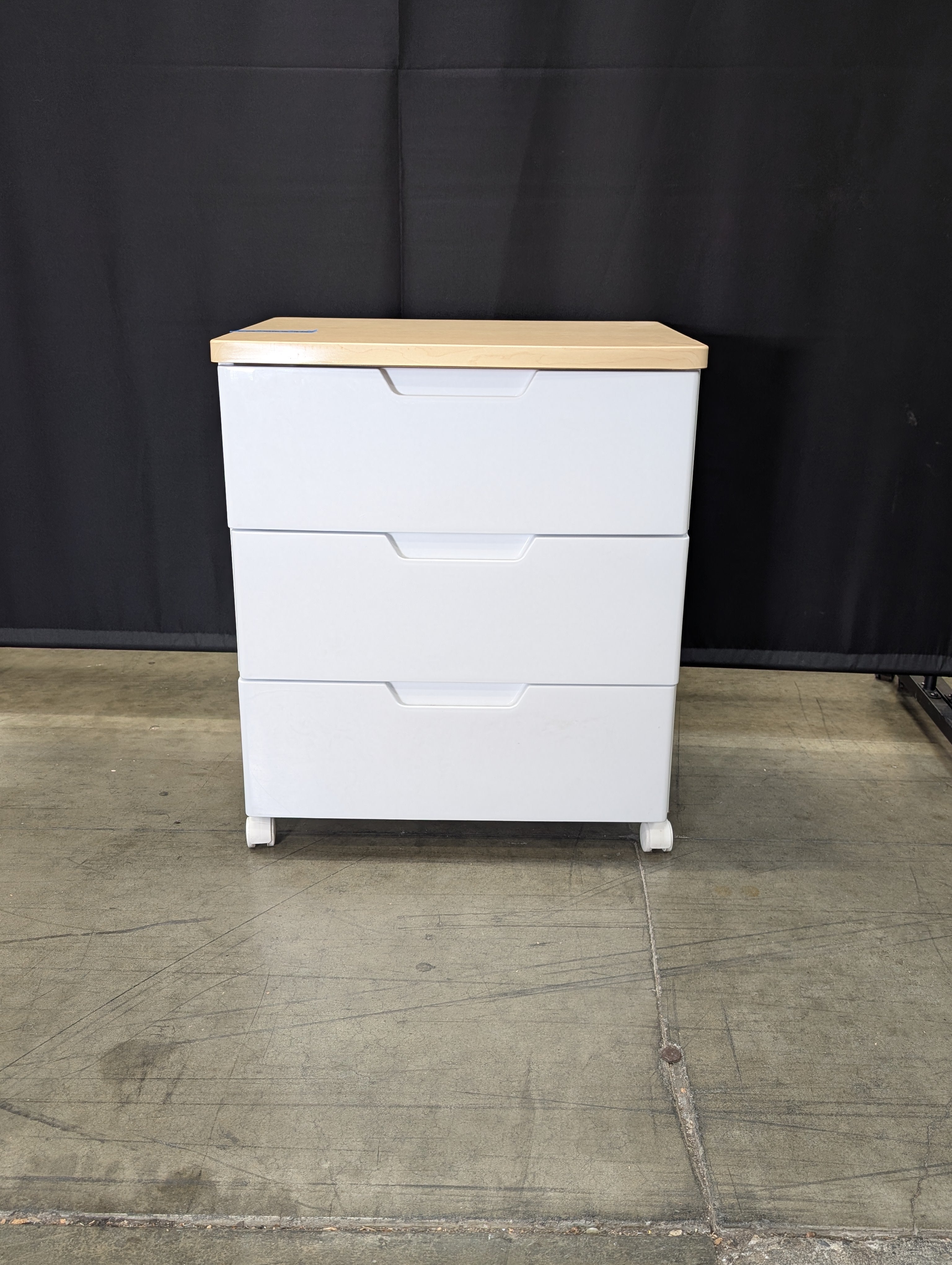Contemporary White Three-Drawer Chest with Light Wood Surface