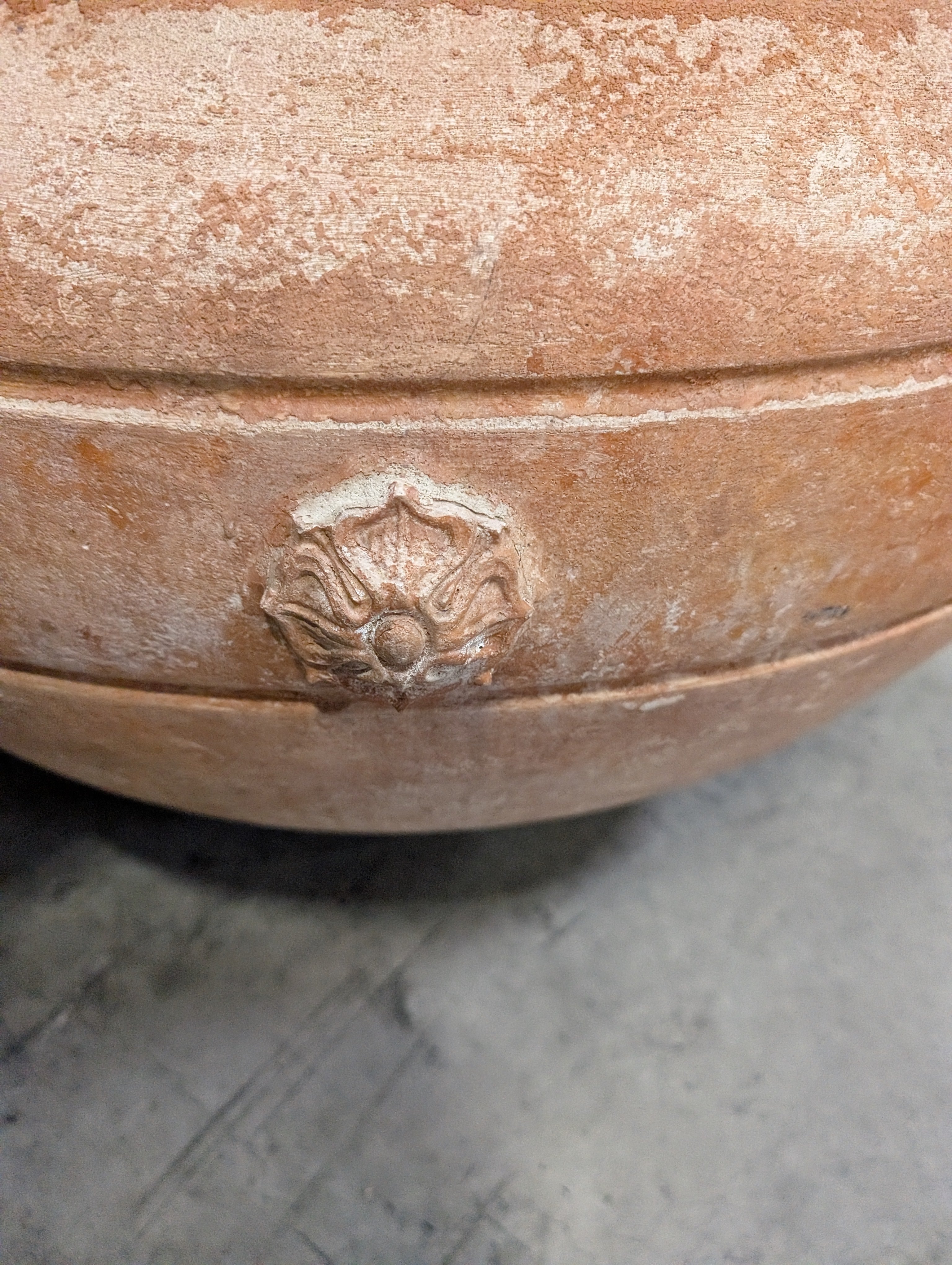 Ornate Terracotta-Style Planter with Lion Head Accents