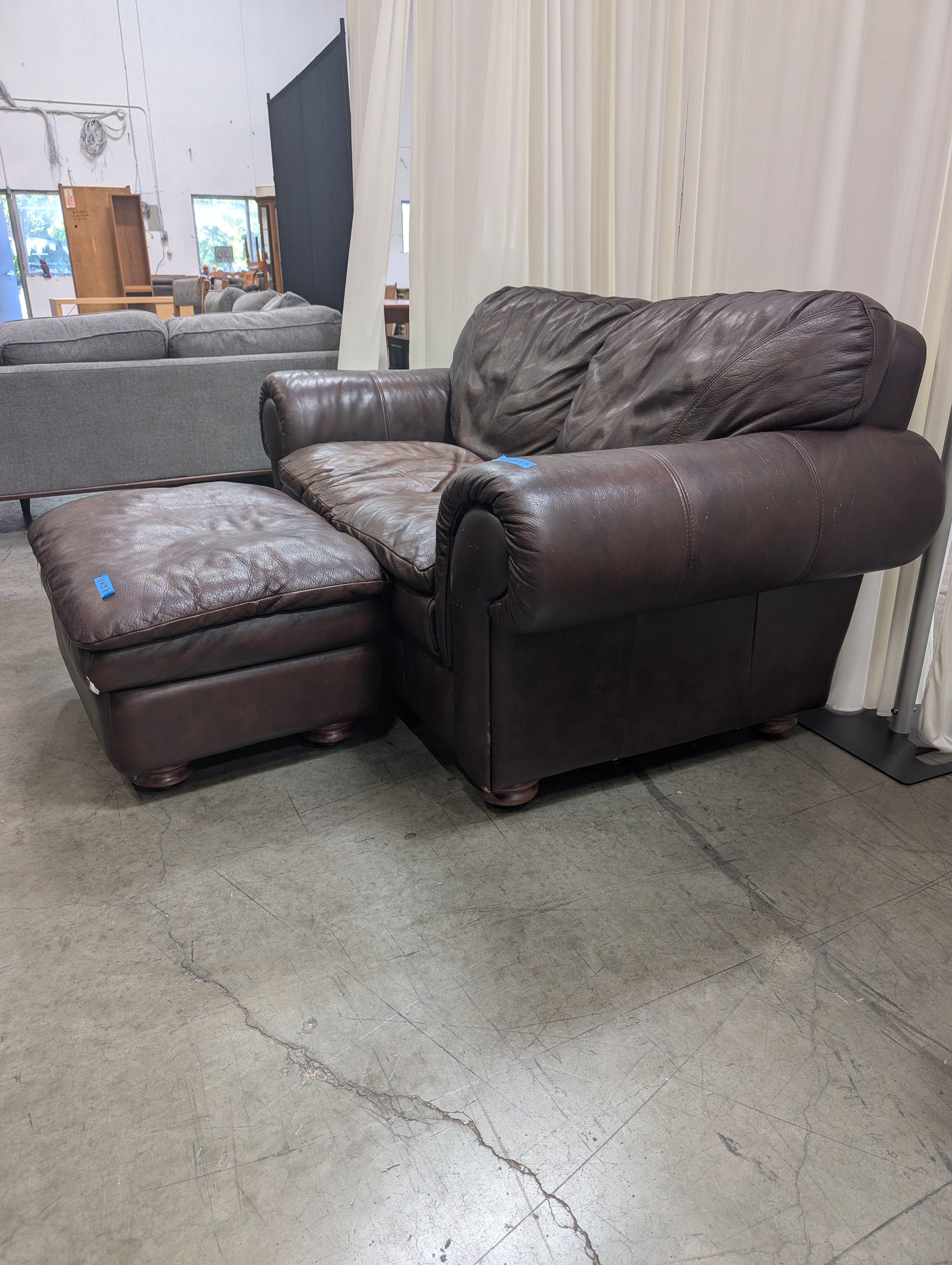 Dark Brown Leather Rolled Arm Couch with matching Ottoman