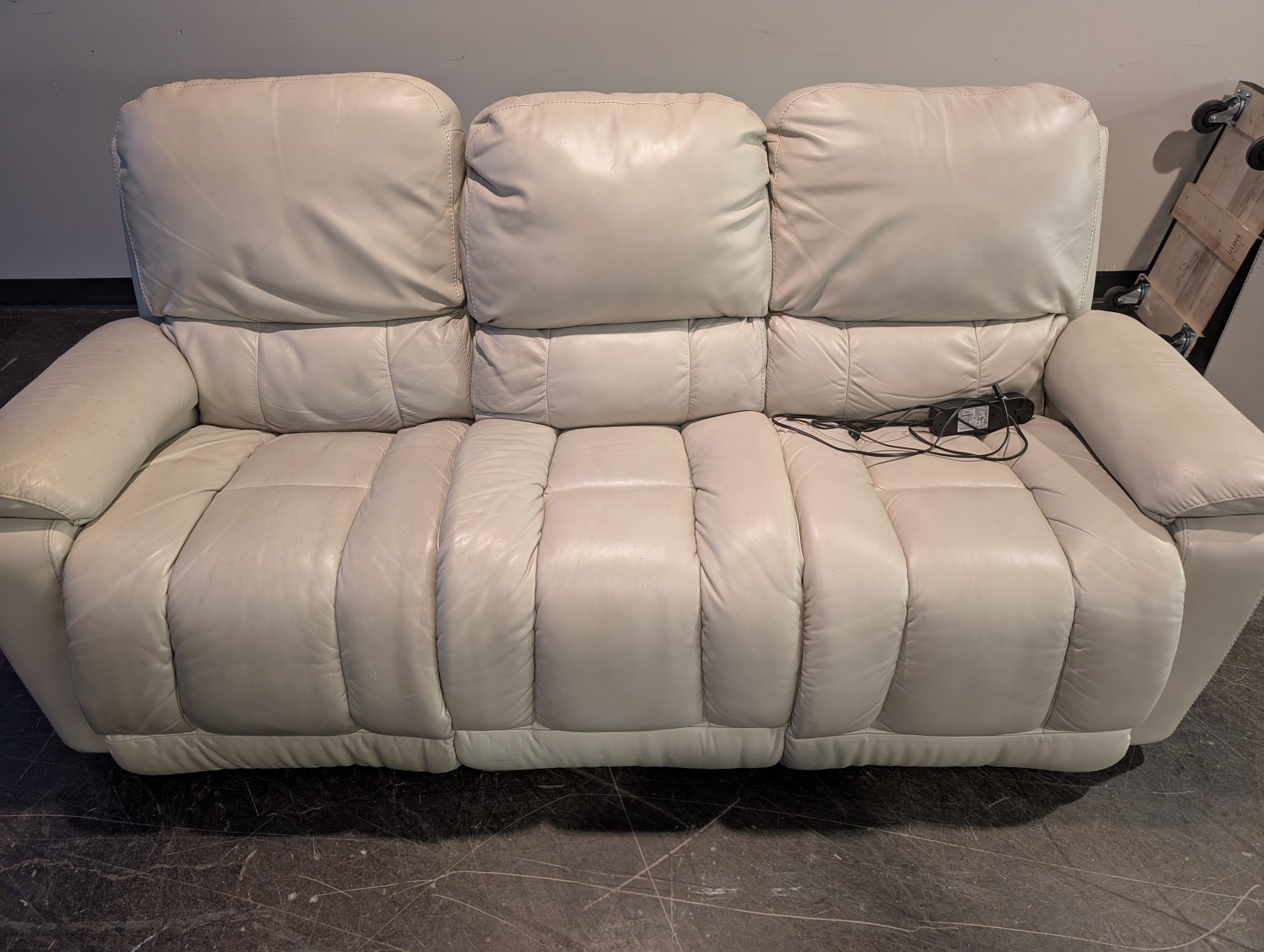Cream Upholstered Two-Seater Reclining Sofa