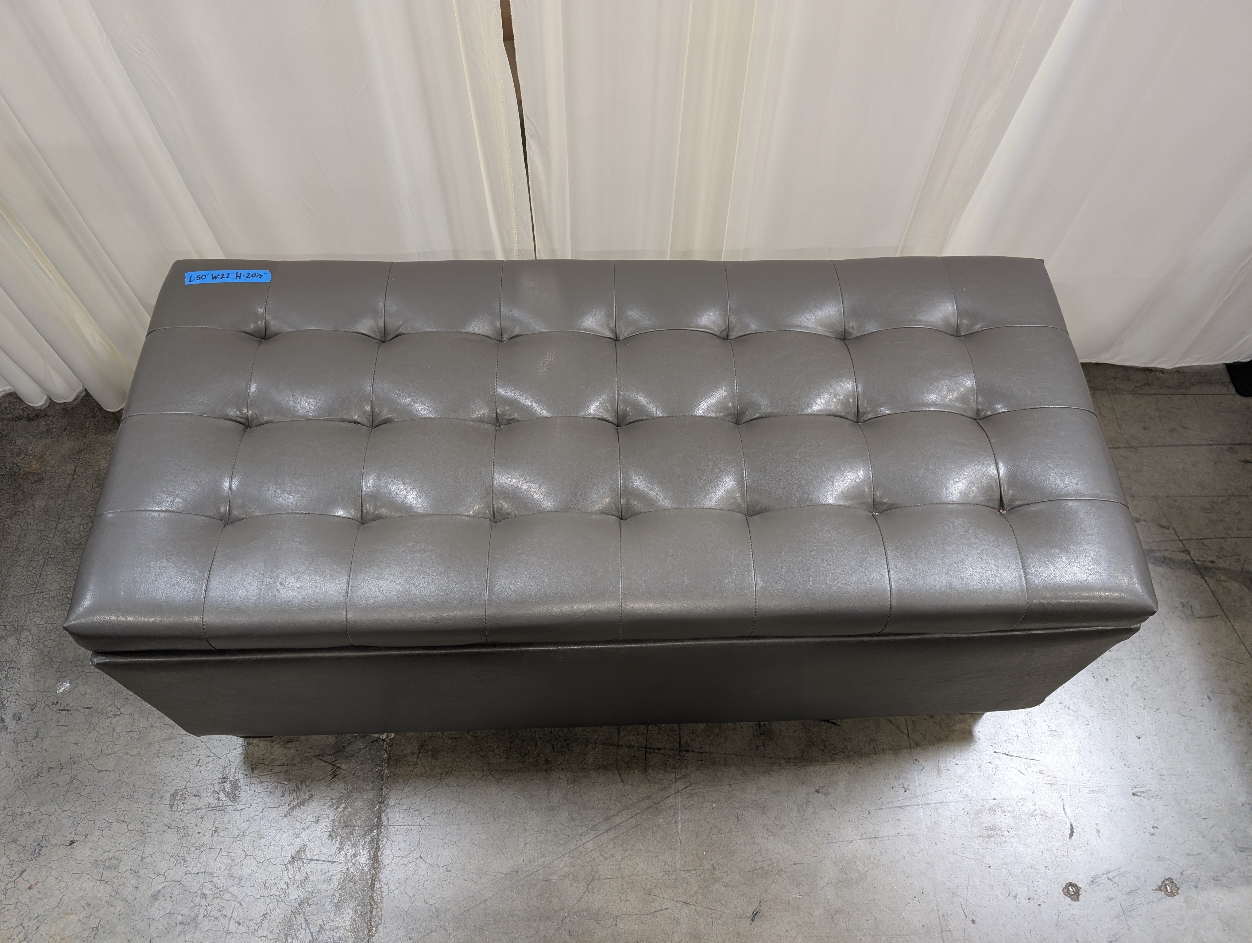 Charcoal Tufted Storage Ottoman in Faux Leather