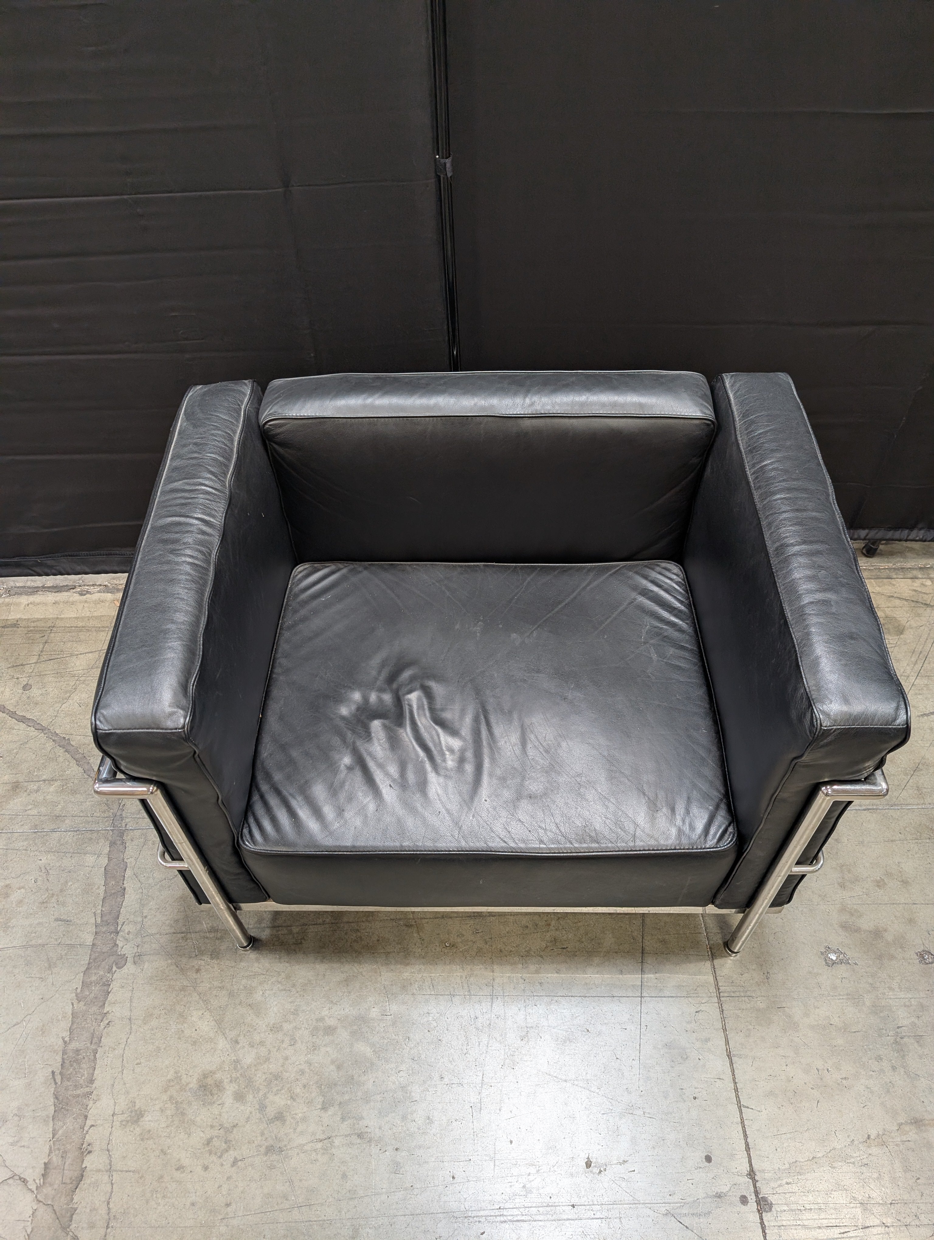 Modern Black Armchair with Polished Metal Frame