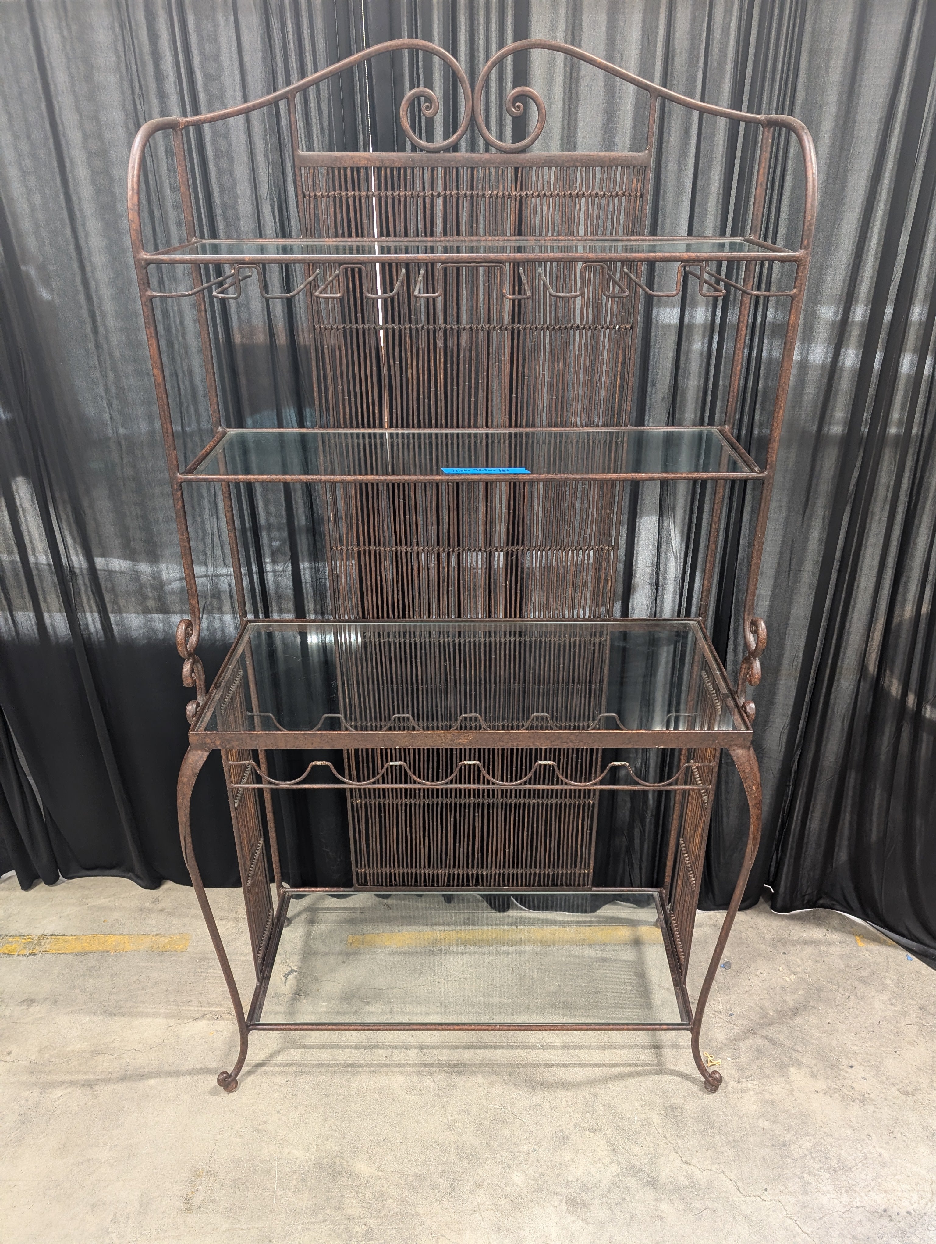 Ornate Dark Metal Baker's Rack with Woven Back