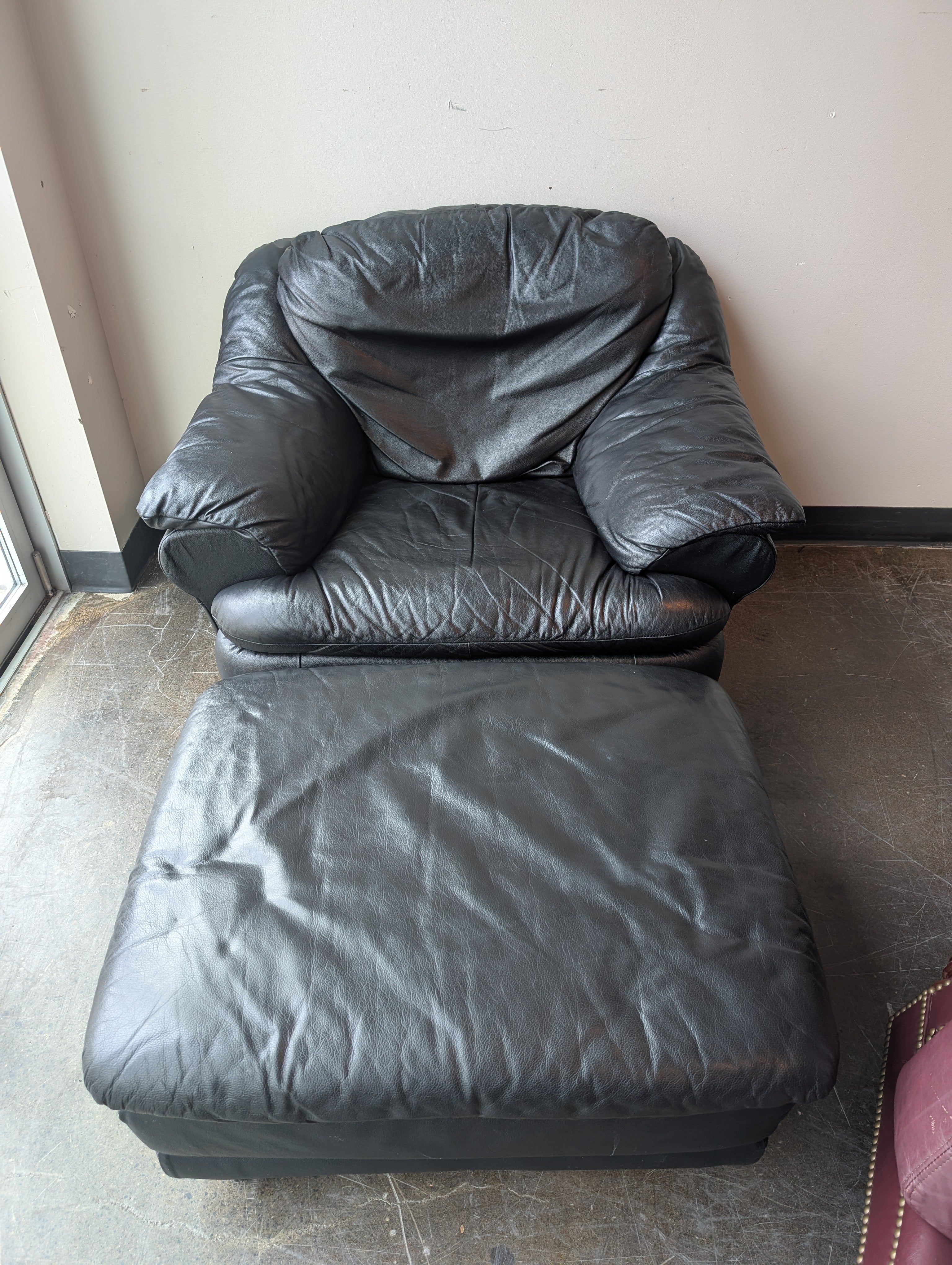 Plush Black Leather Armchair and Ottoman Set