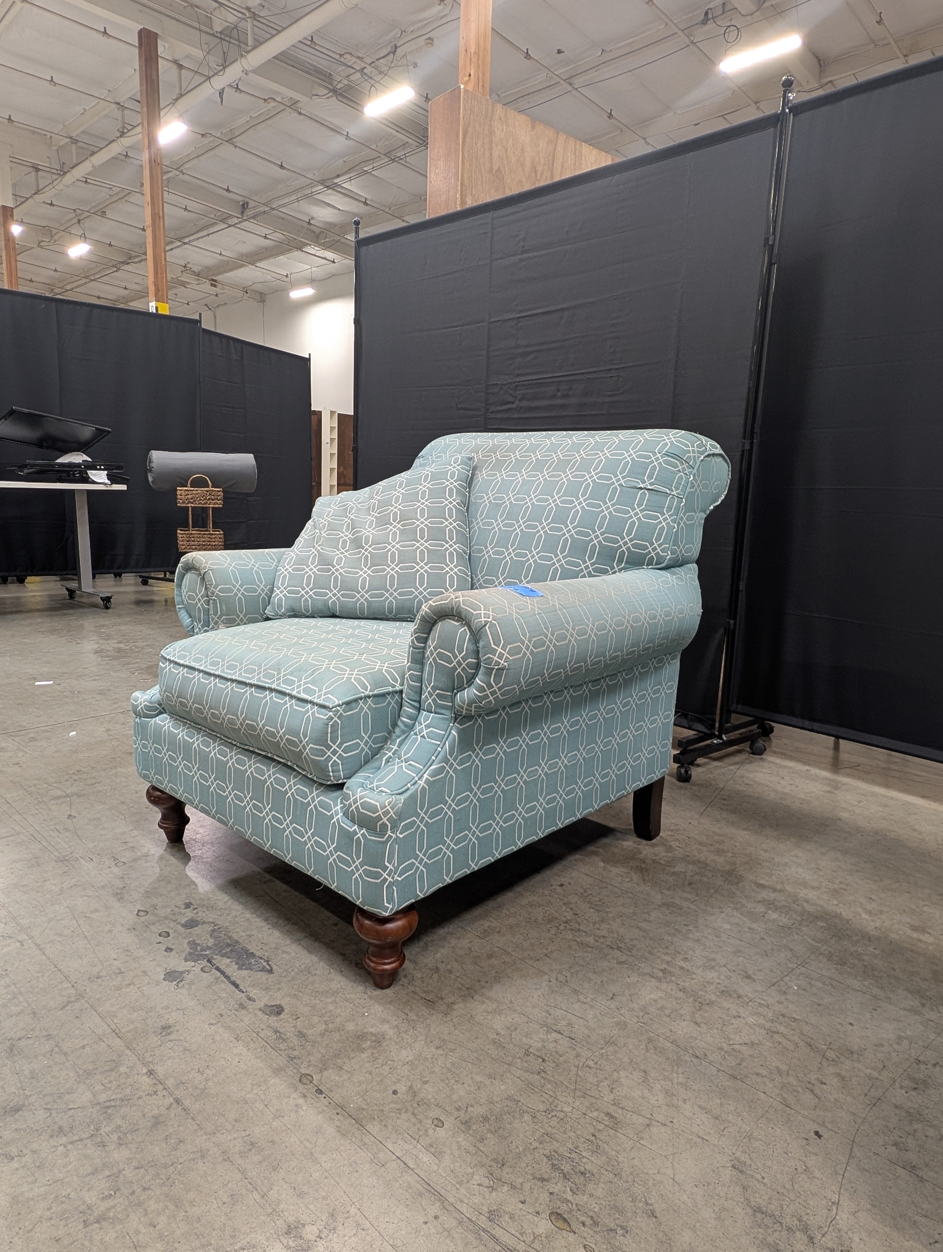 Comfortable Armchair with Green Wavy Pattern Slipcover
