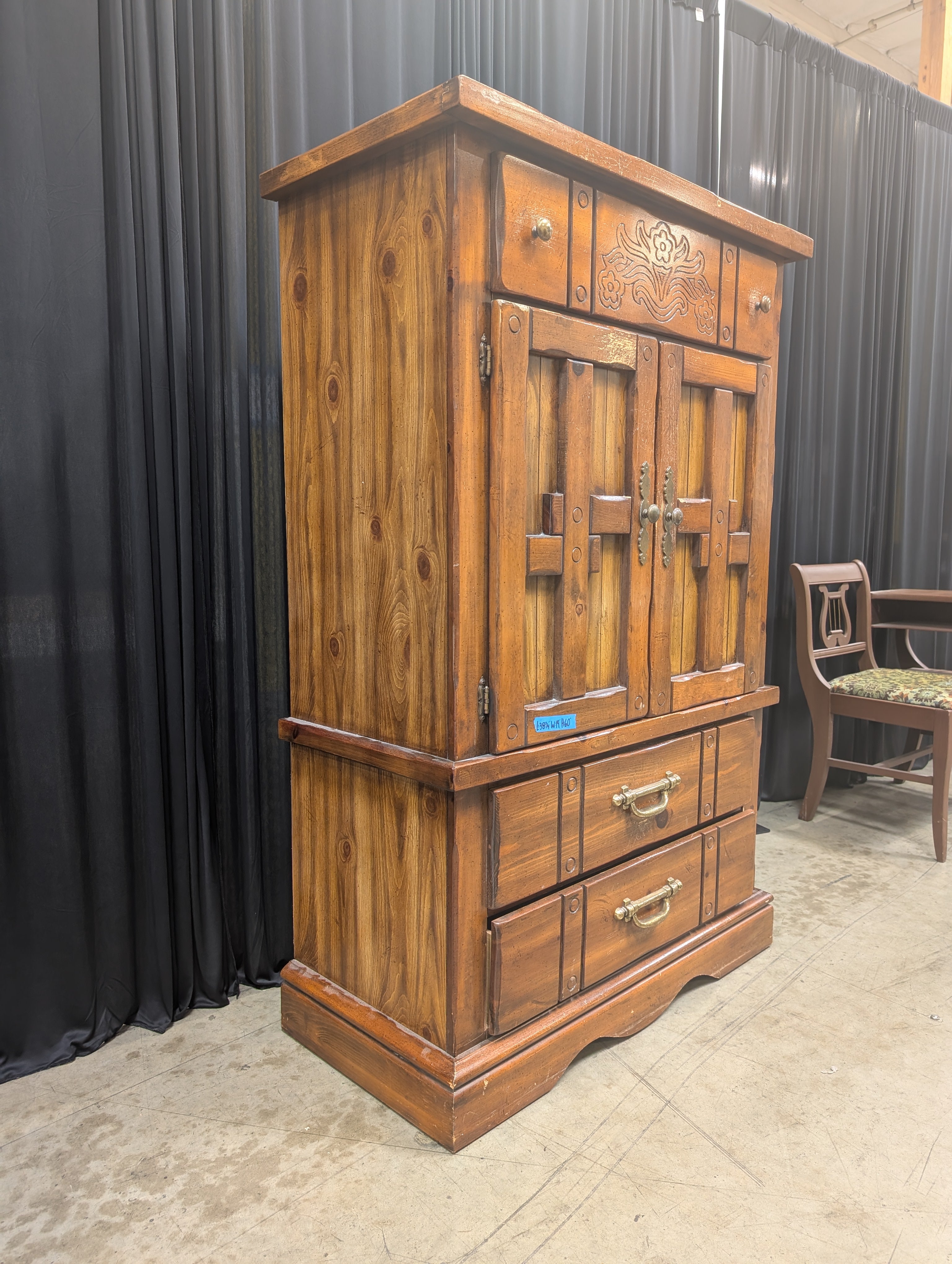 Rustic Brown Wood Armoire with Carved Details