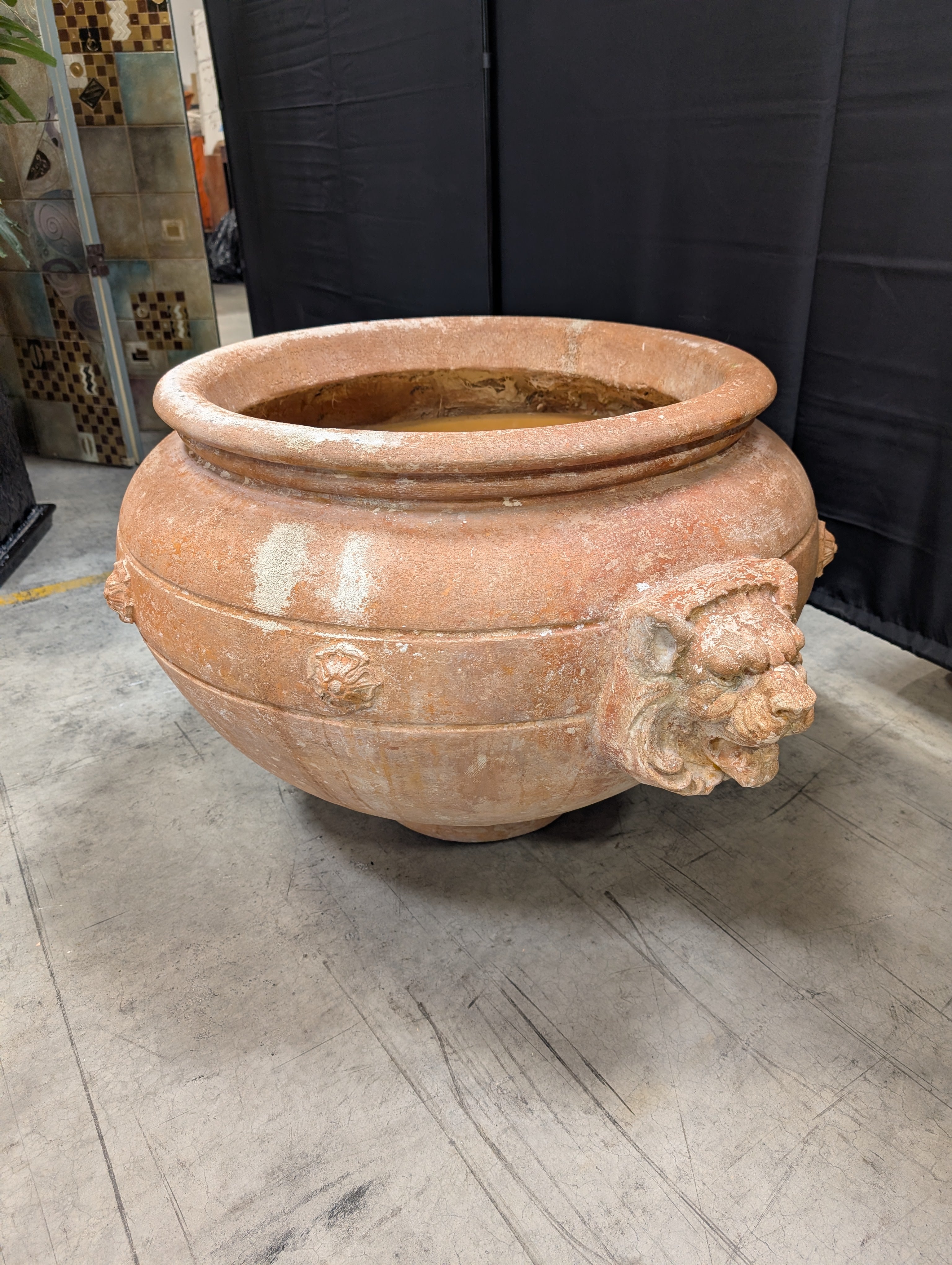 Ornate Terracotta-Style Planter with Lion Head Accents