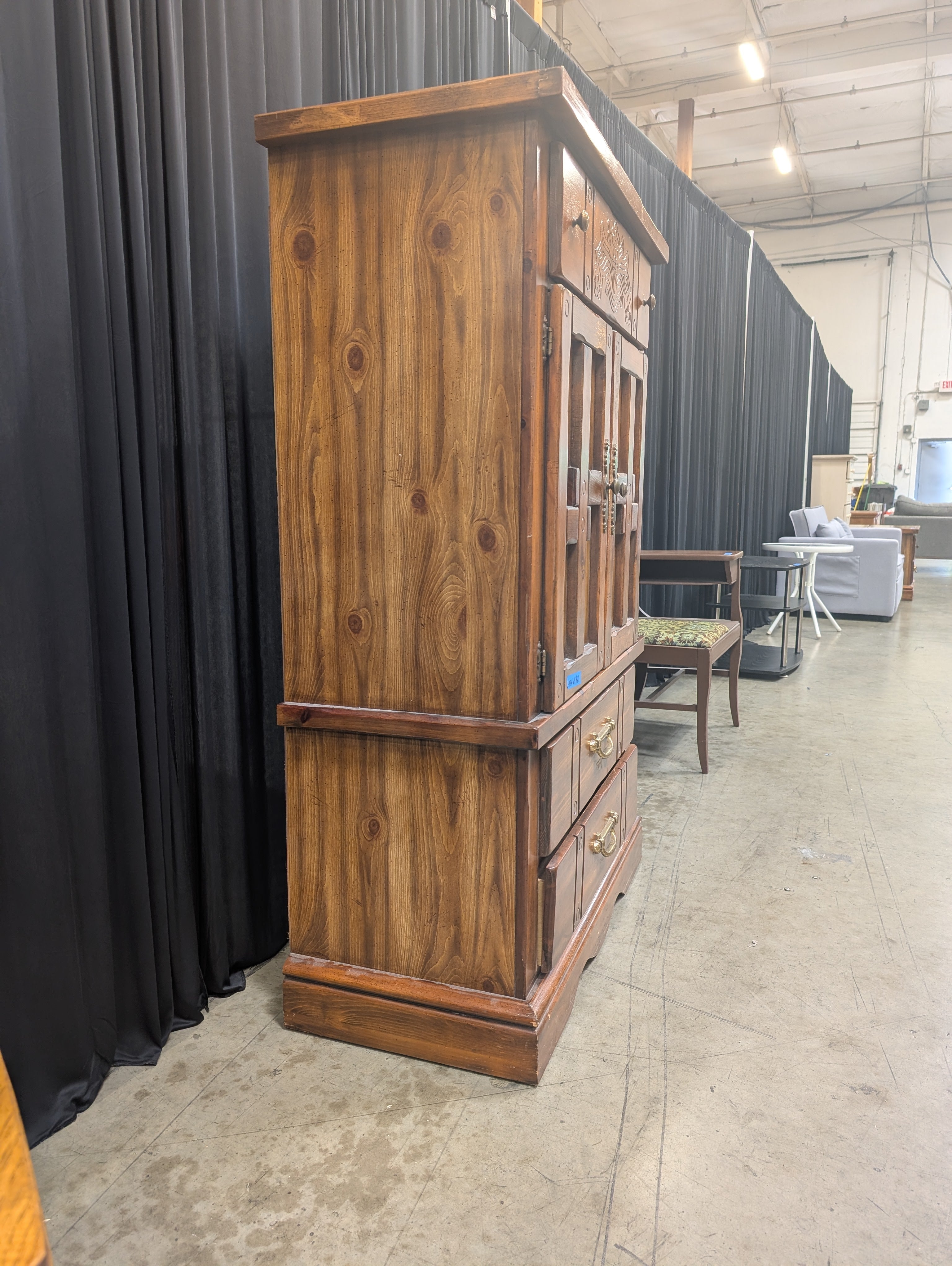 Rustic Brown Wood Armoire with Carved Details