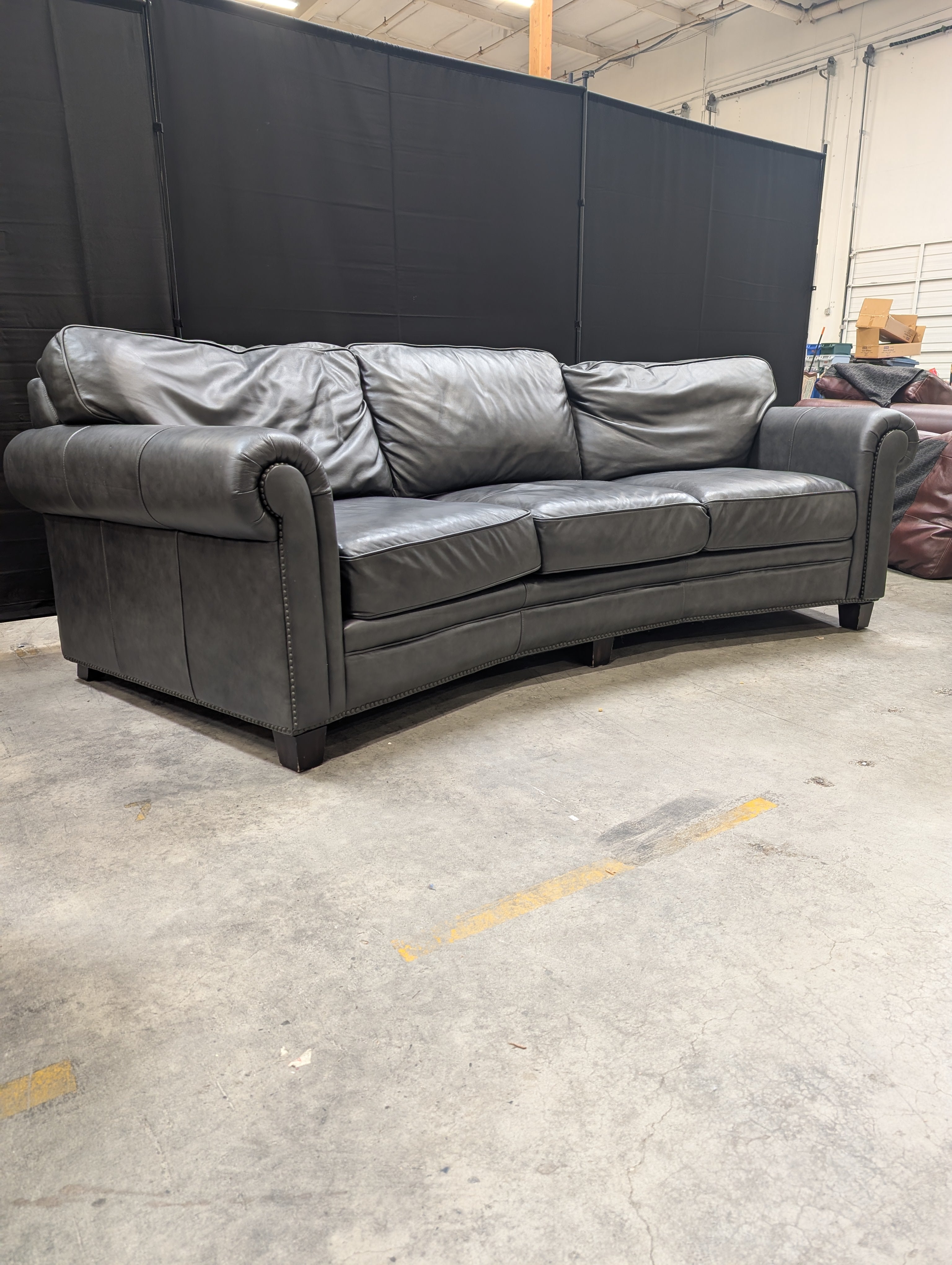 Curved Dark Grey Leather Three-Seater Sofa
