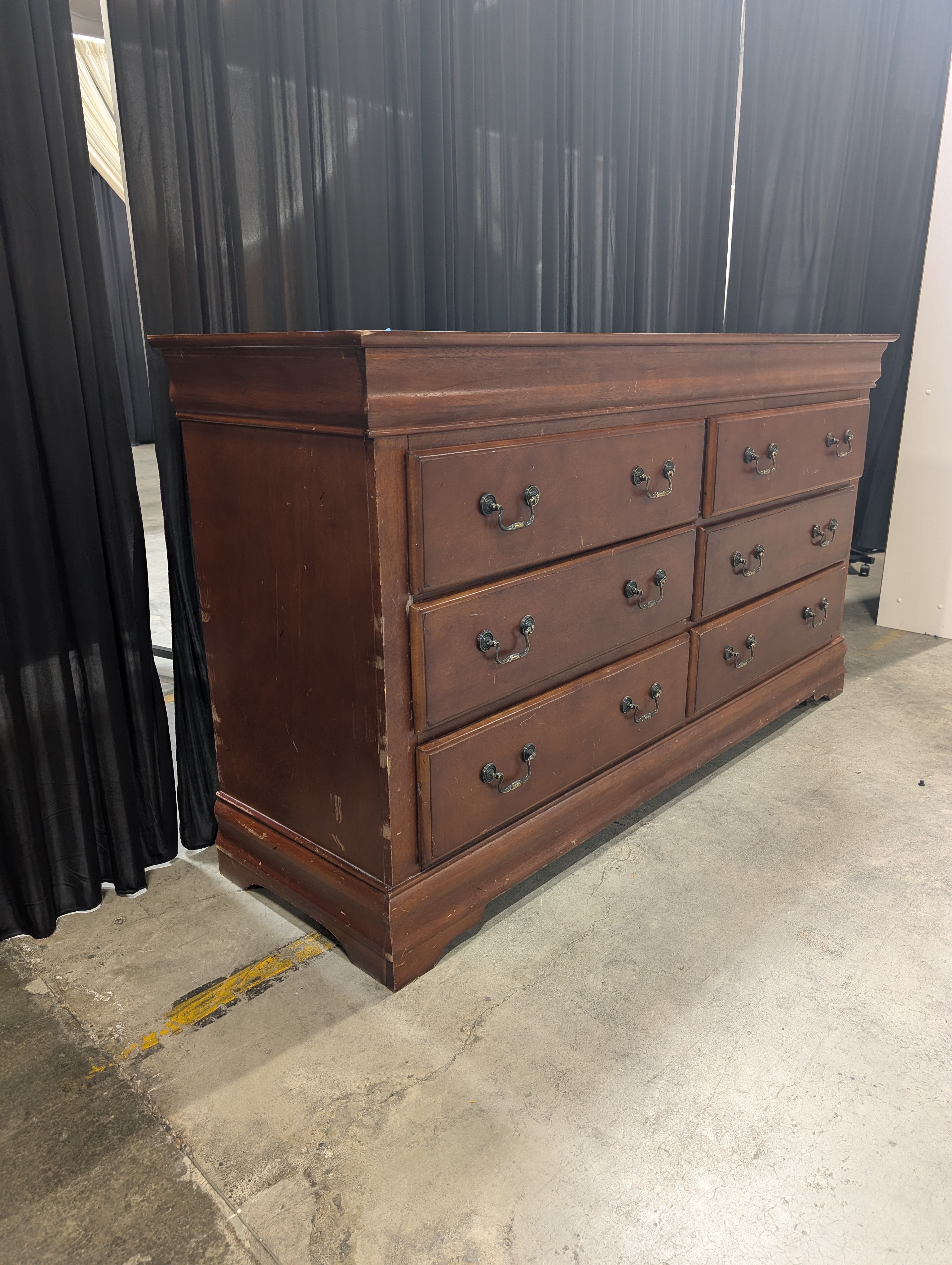 Dark Wood Six-Drawer Dresser with Ornate Hardware