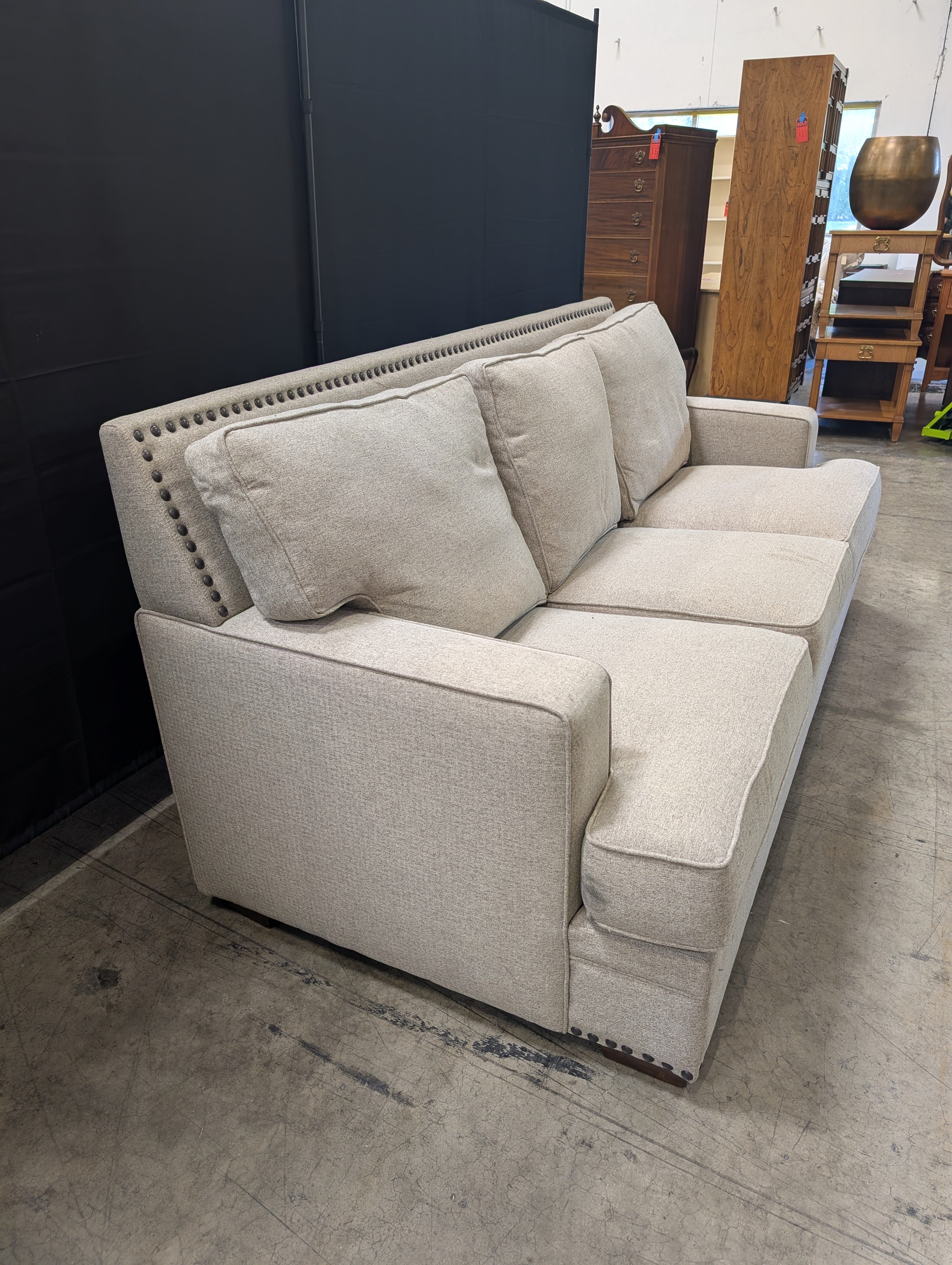 Grey Fabric Three-Seat Couch with Nailhead Trim