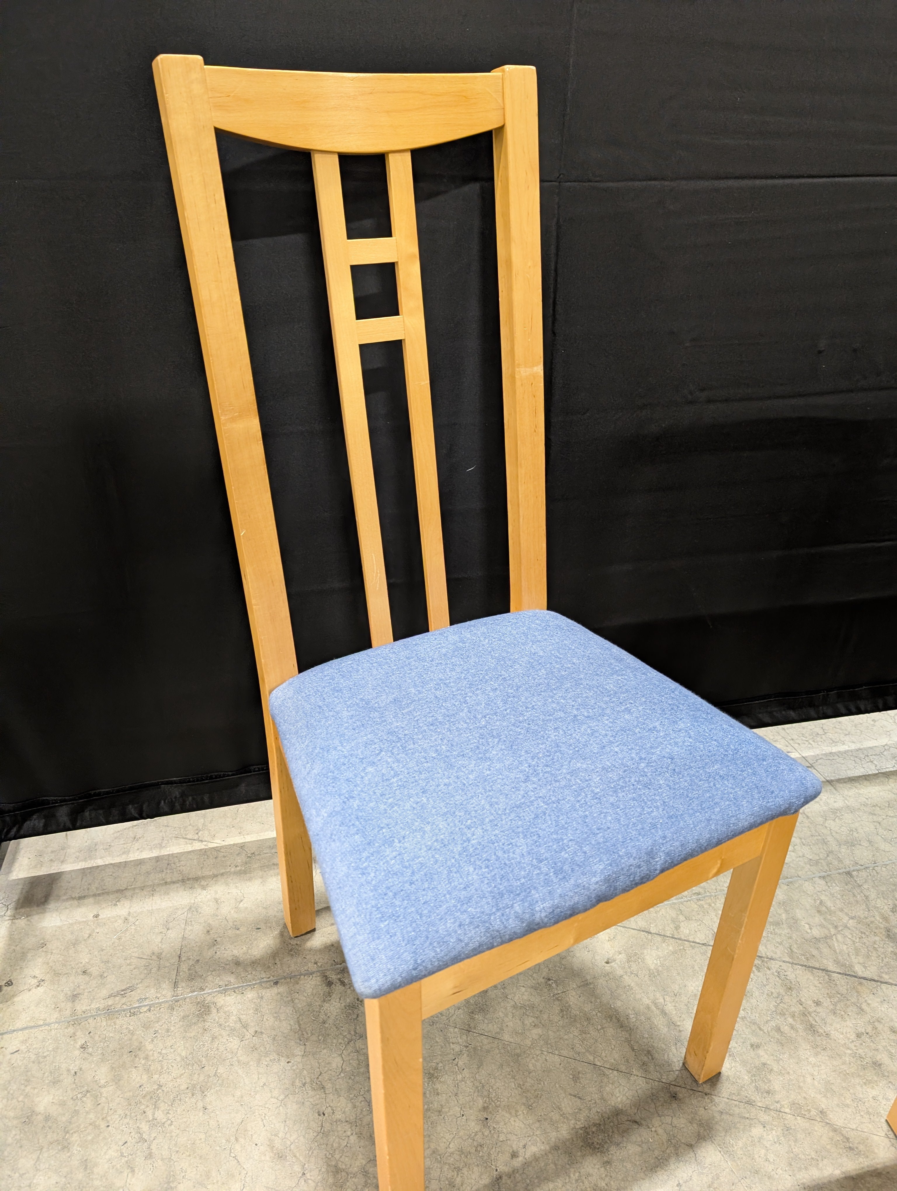 Versatile Extendable Light Wood Dining Table with Six Blue Upholstered Chairs