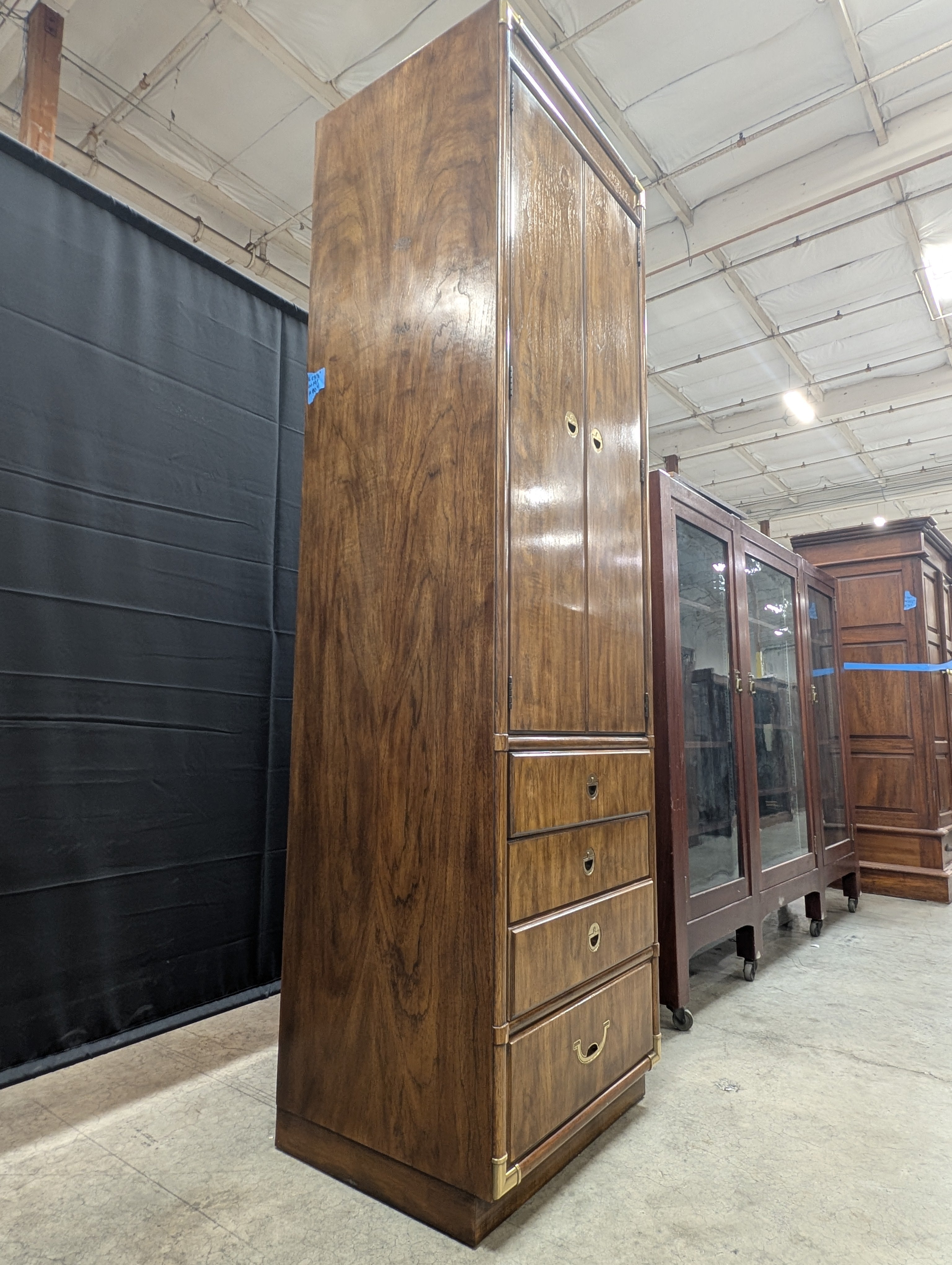 Tall Wooden Drexel Cabinet with Brass Accents and Multiple Drawers