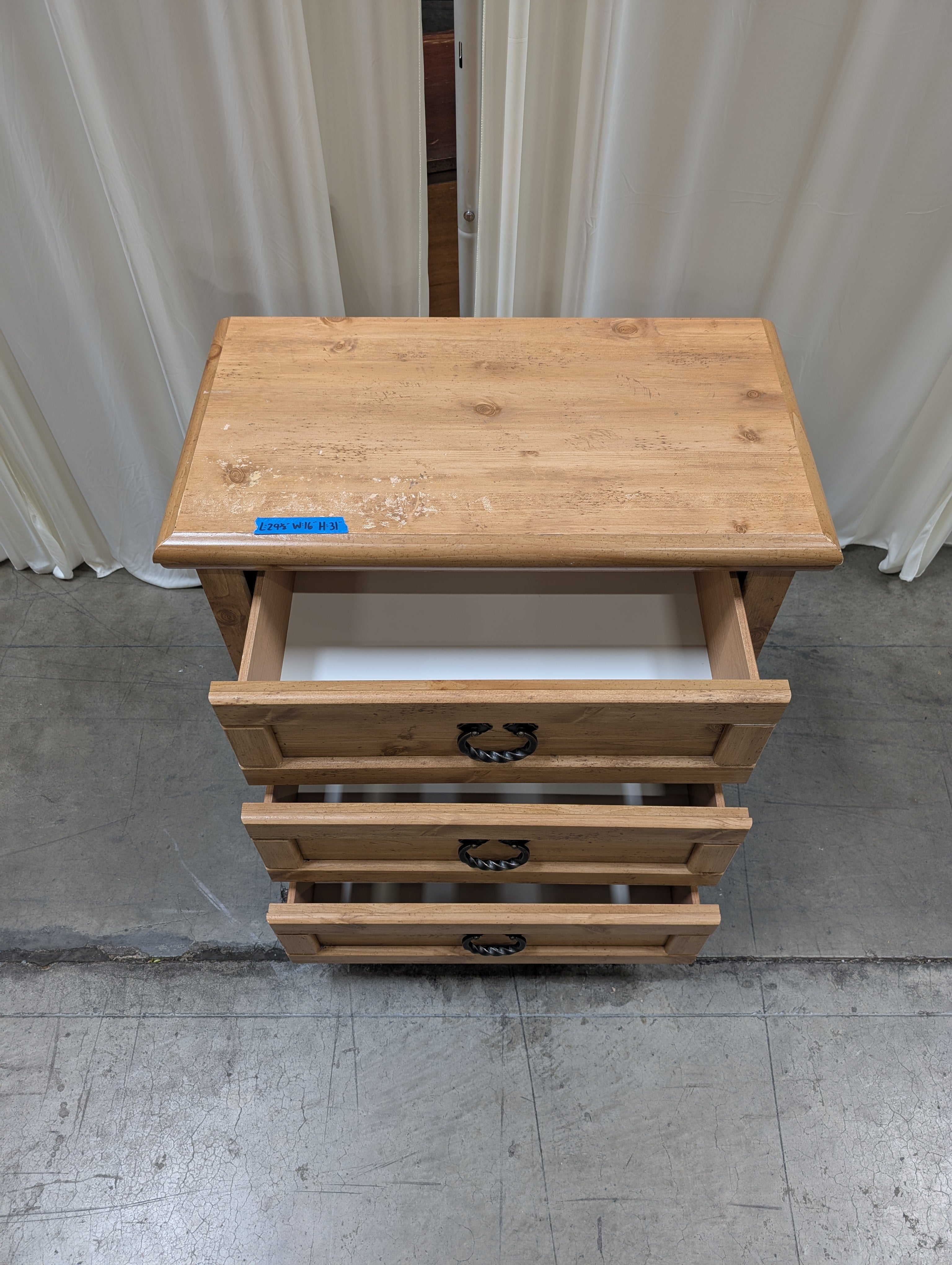 Light Wood Three-Drawer Nightstand with Metal Pulls