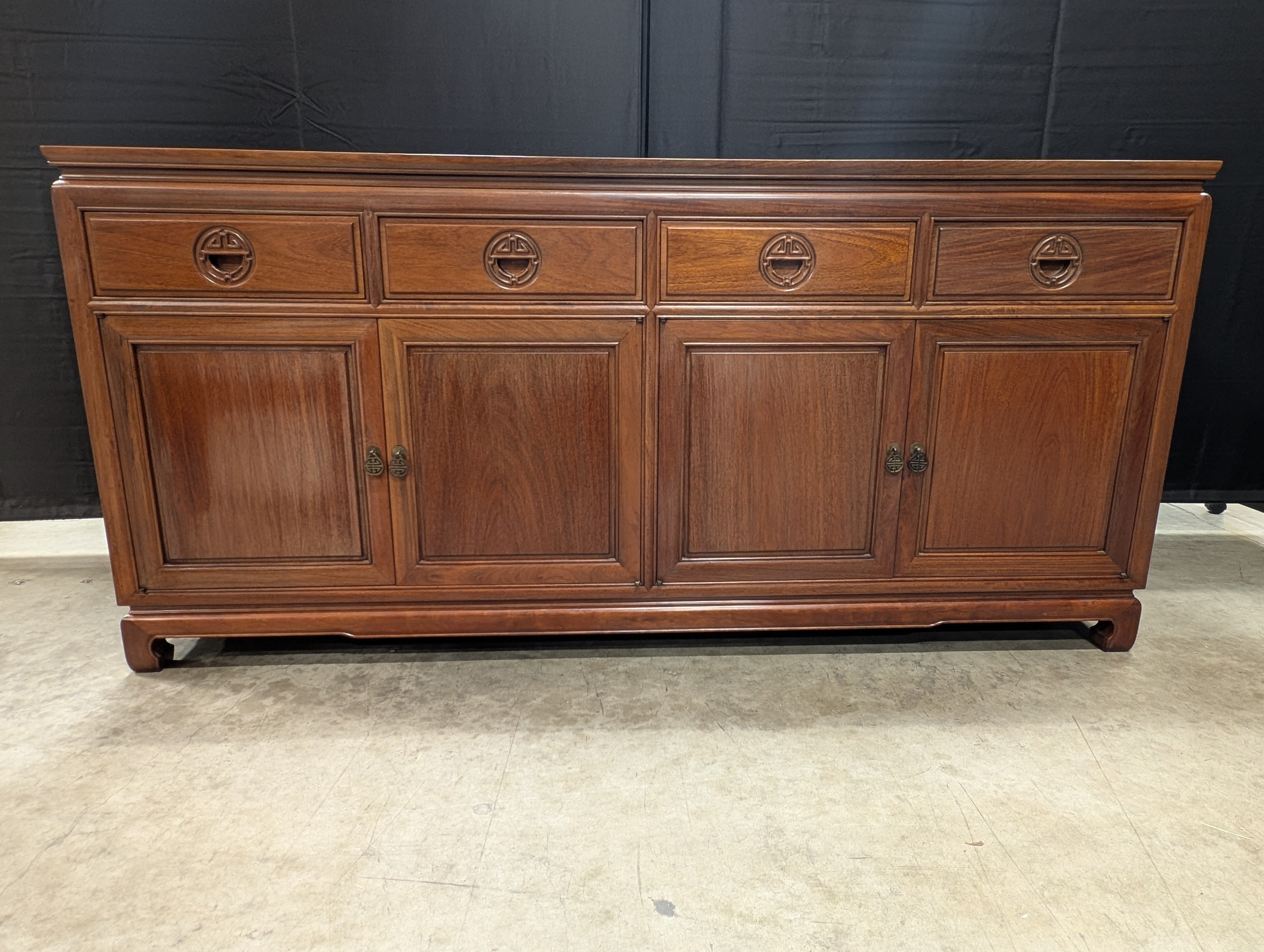 Rich Toned Wooden Sideboard with Carved Accents