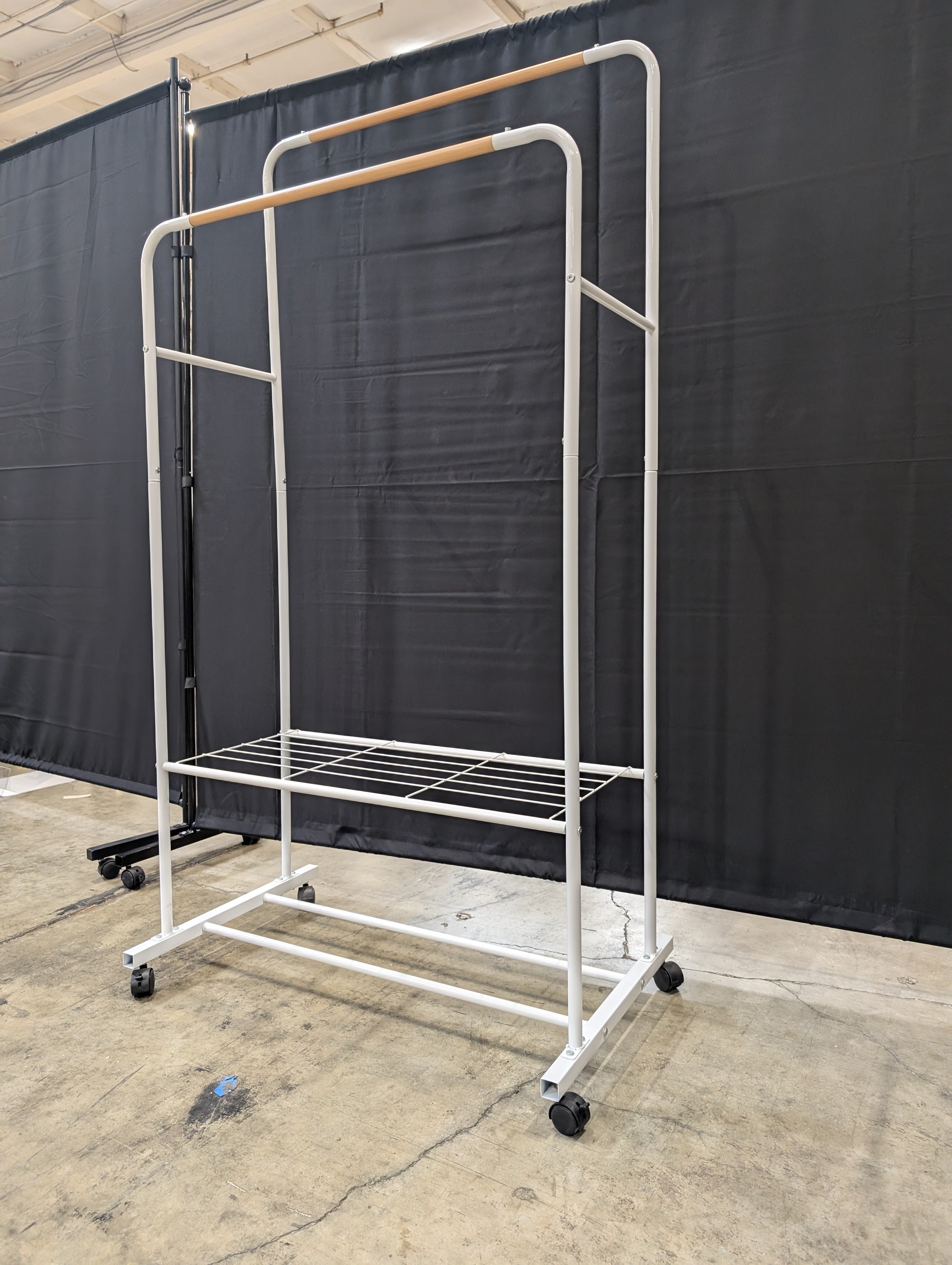 White Metal Rolling Garment Rack with Dual Hanging Rails and Storage Shelf