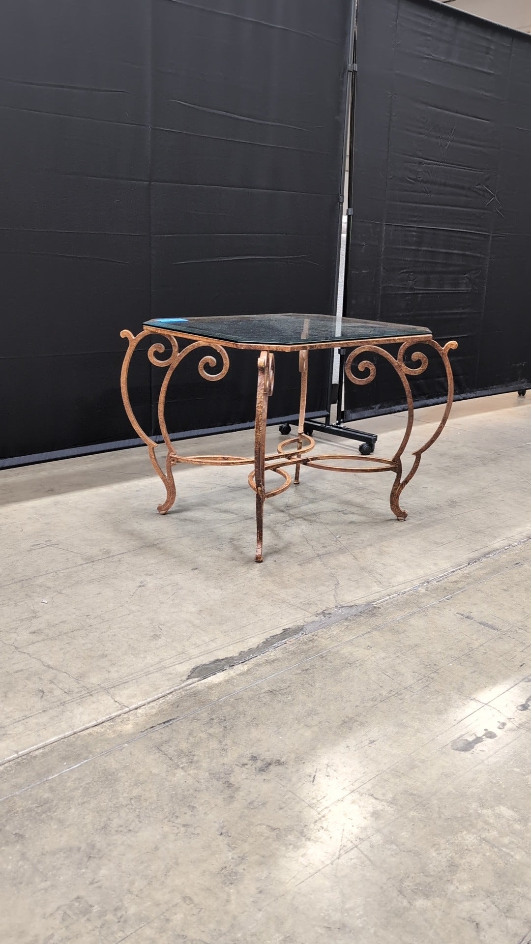 Octagonal Glass Top Accent Table with Scrollwork Metal Base