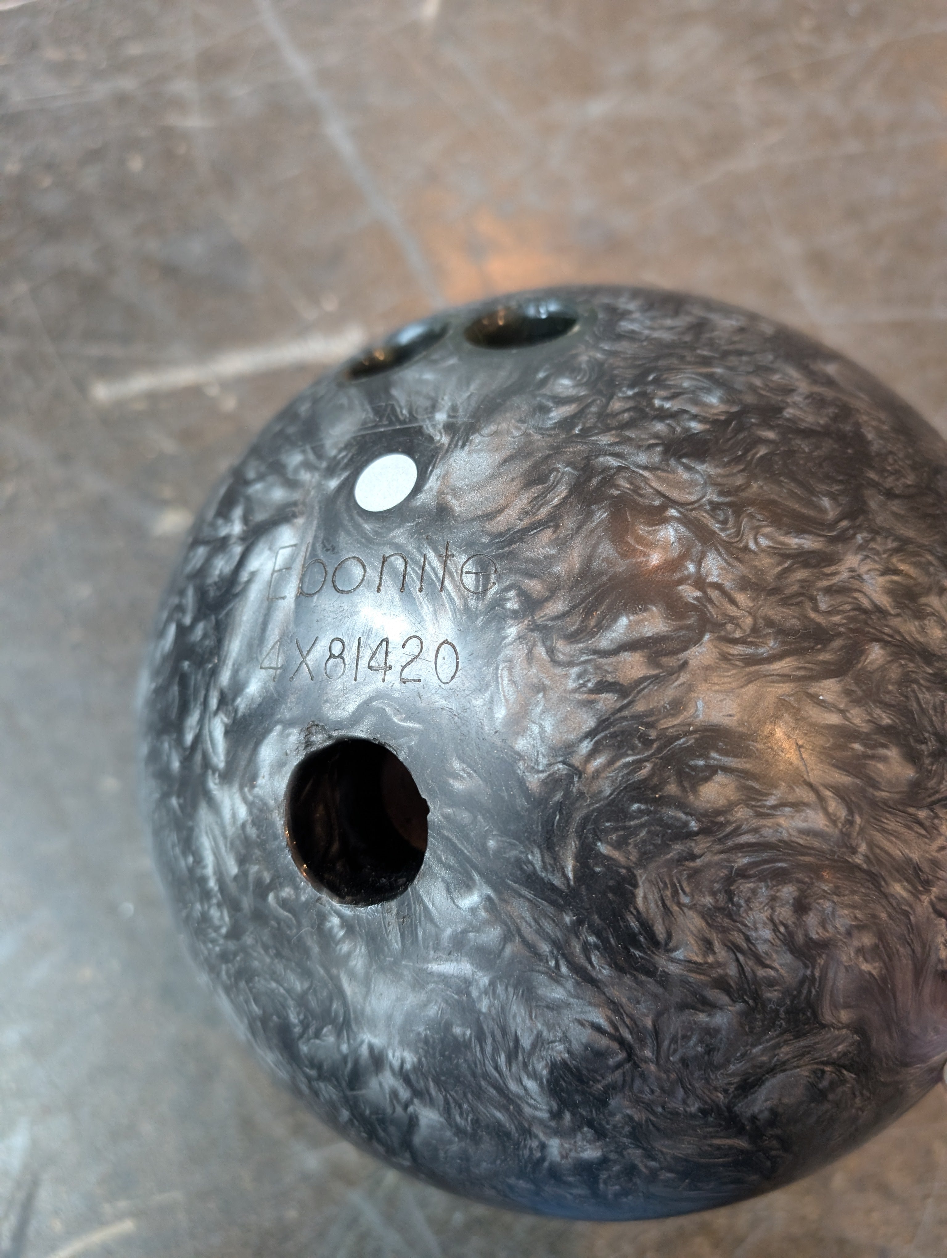 Ebonite Bowling Ball with Textured Brown Carry Bag