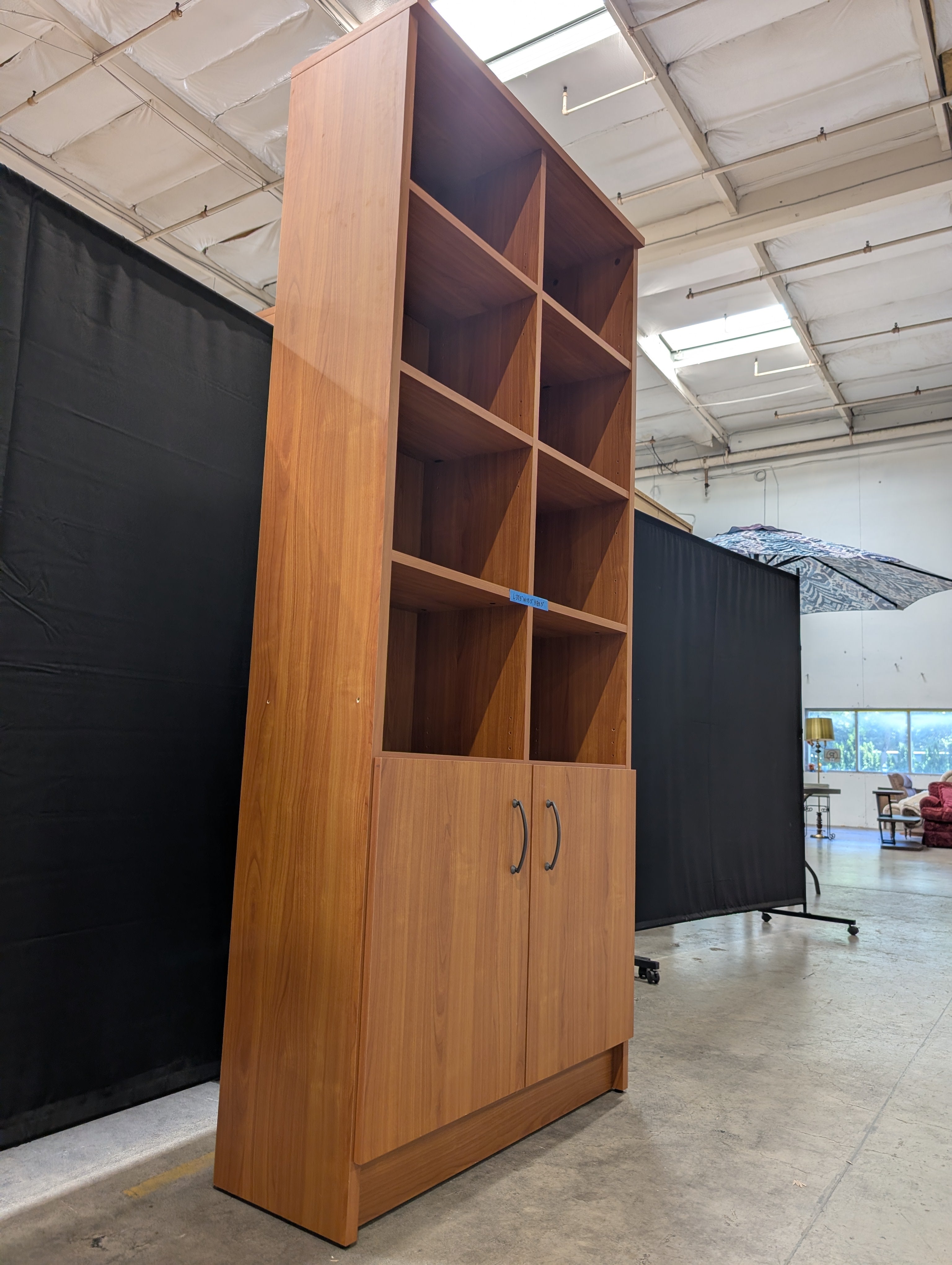 Cherry Wood Tone Multi-Section Bookcase with Lower Cabinet