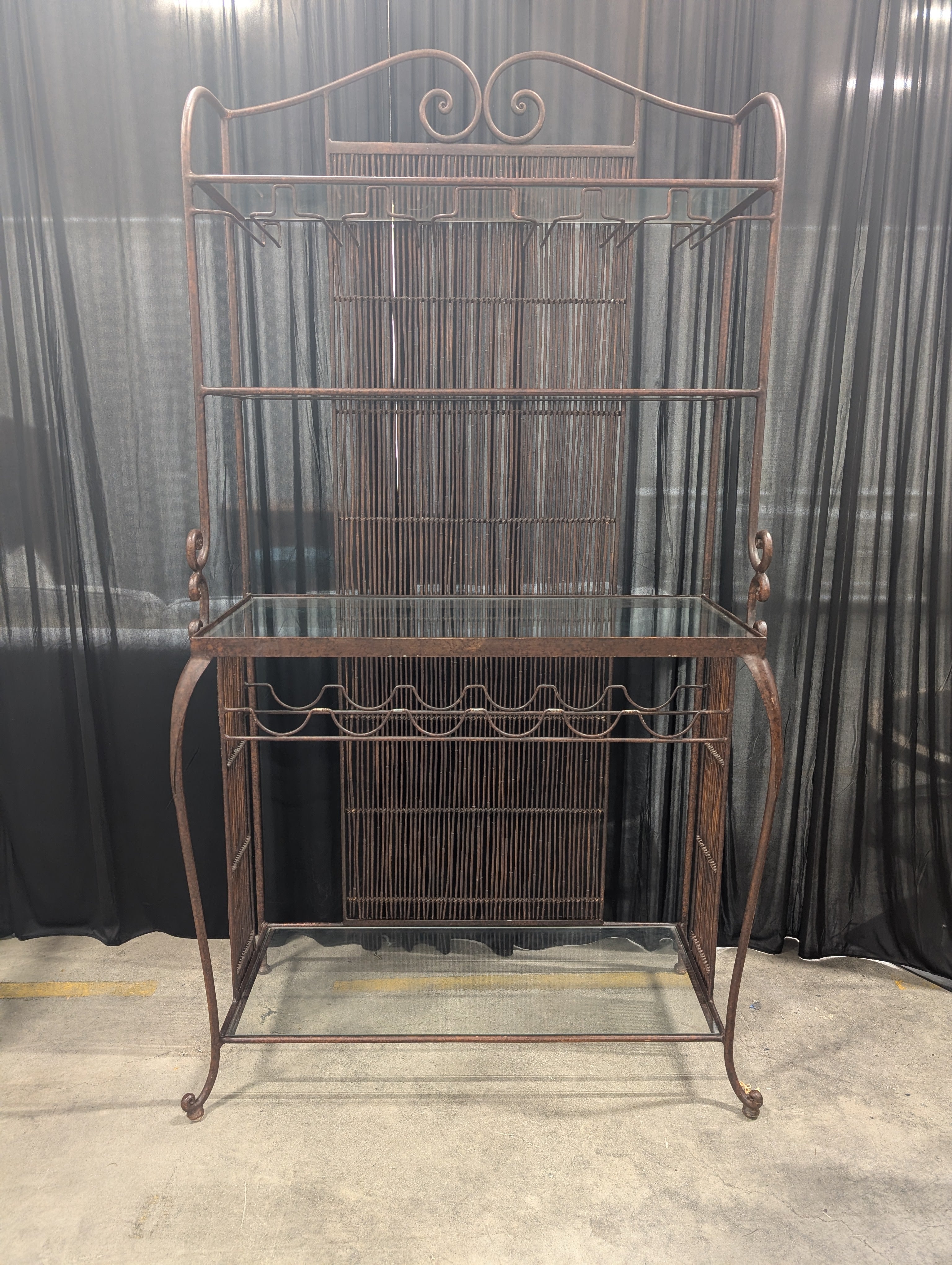 Ornate Dark Metal Baker's Rack with Woven Back