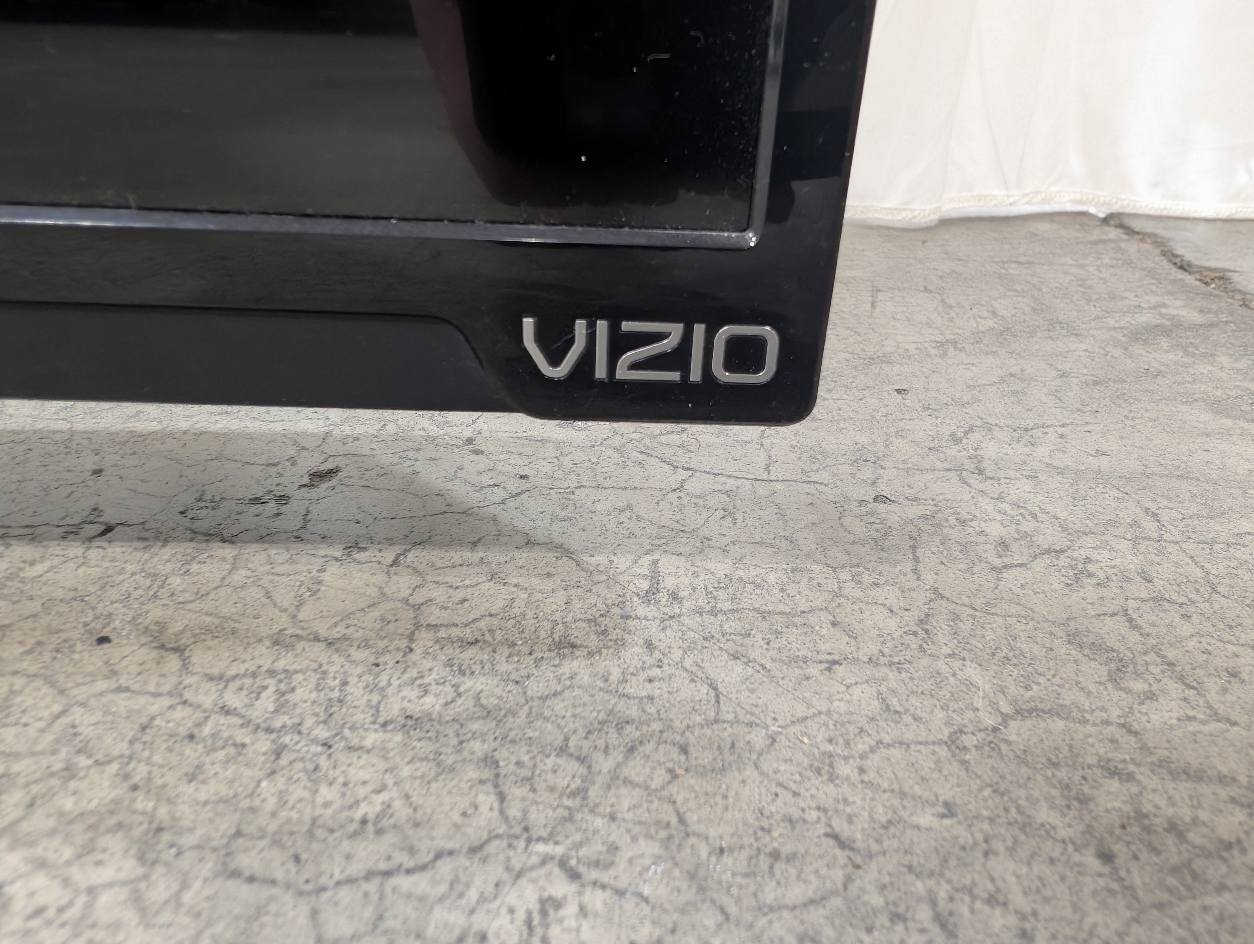 Black Flat Screen VIZIO TV with Stand