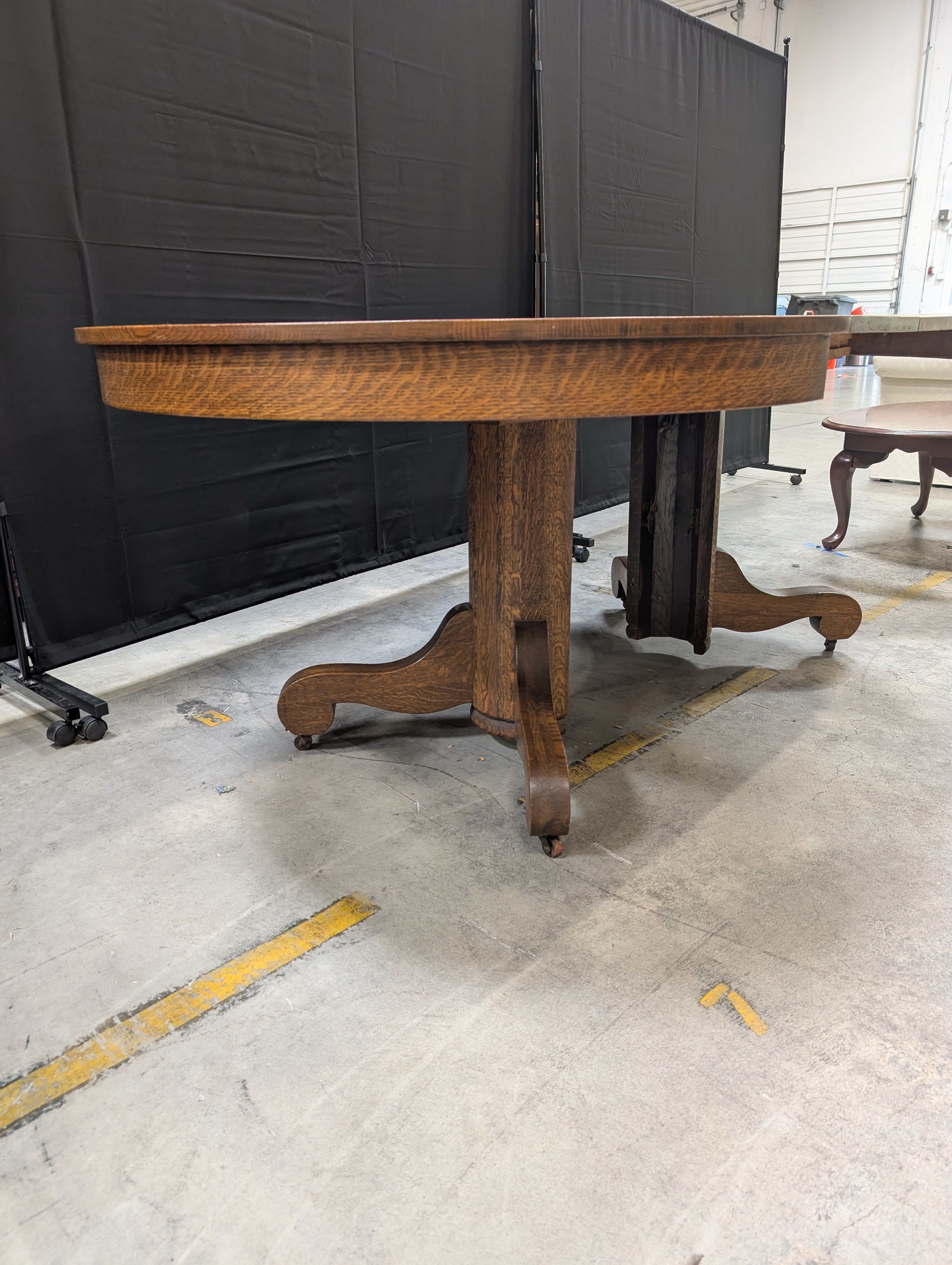 Round Dark Stained Wood Pedestal Dining Table