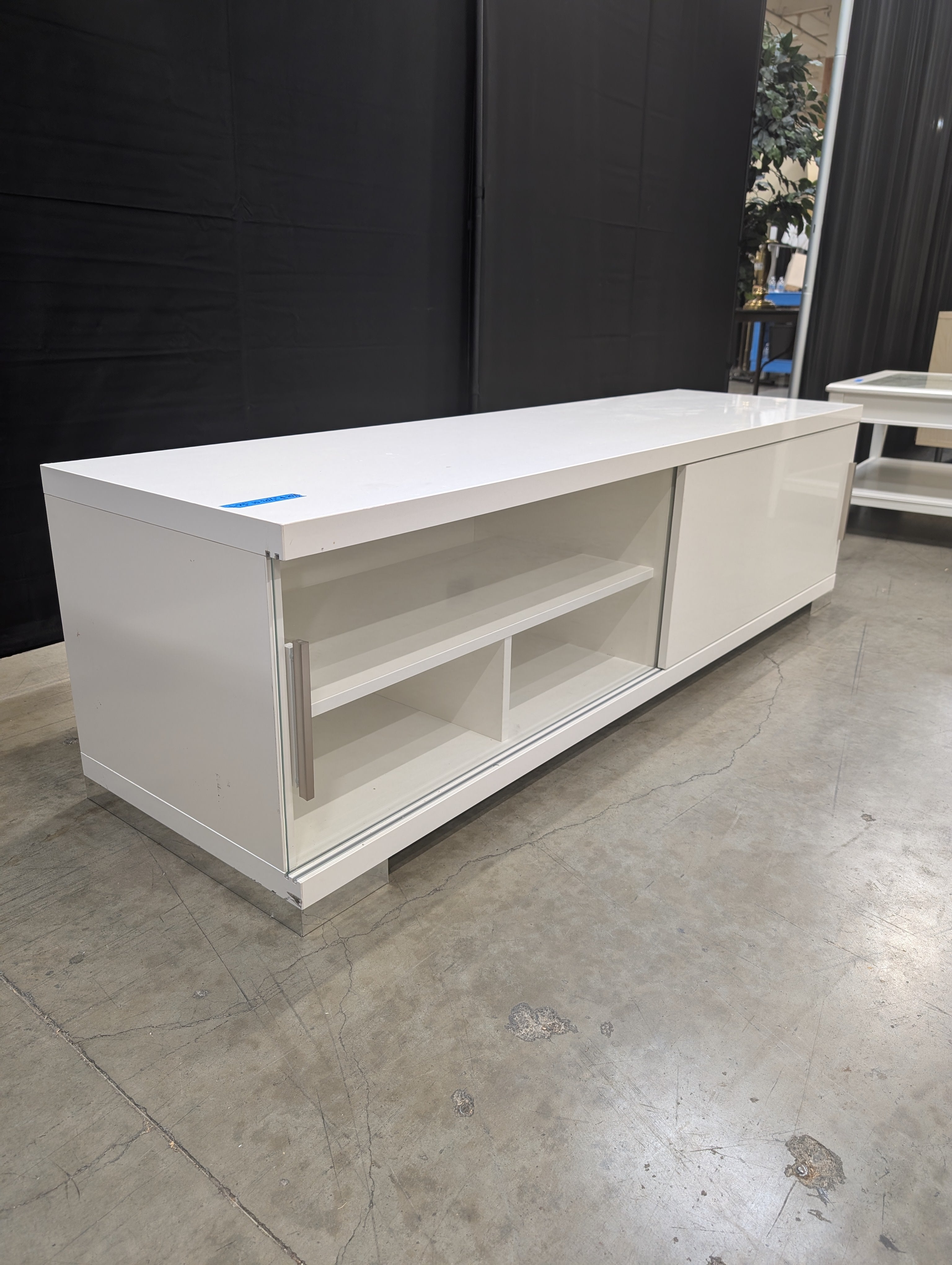 Sleek White Entertainment Unit with Sliding Doors