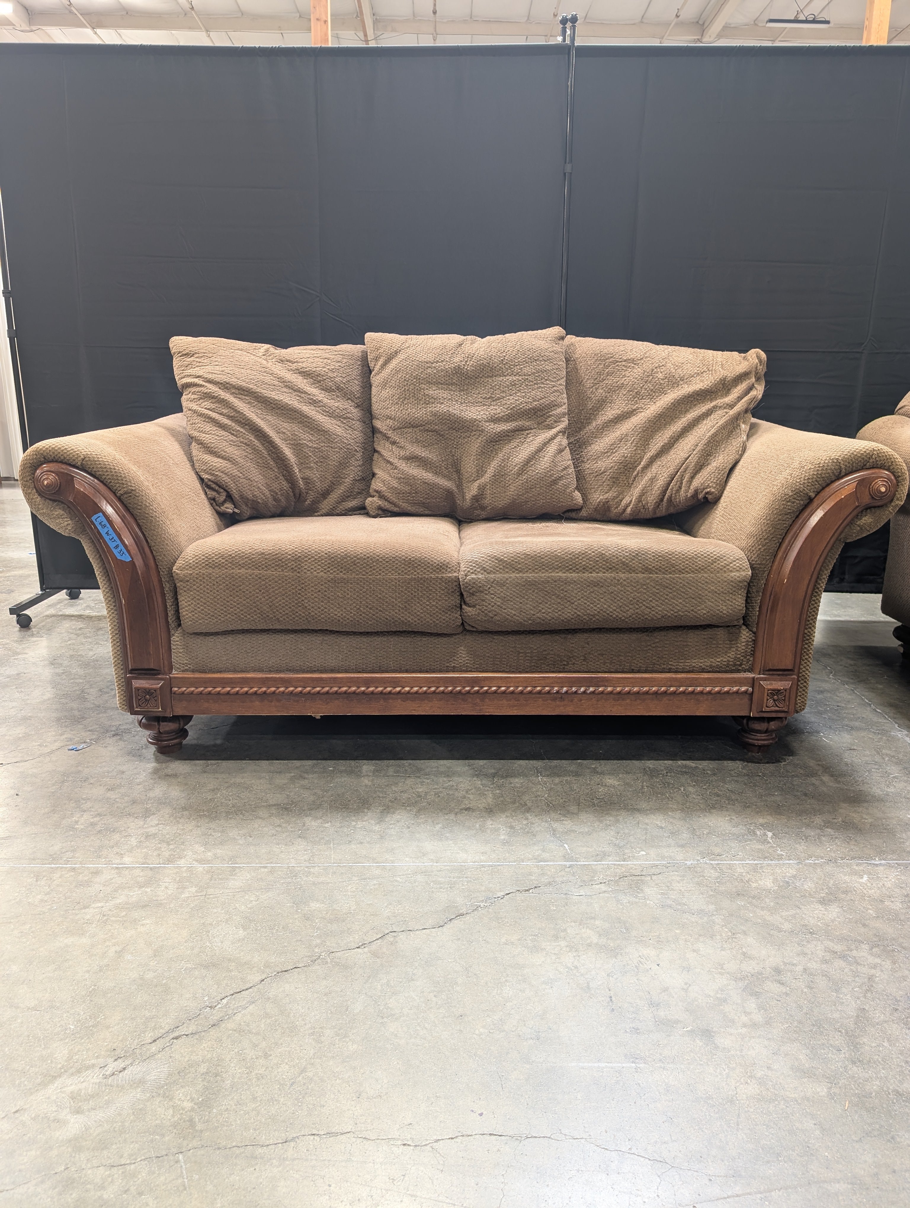 Brown Textured Fabric Loveseat with Wood Trim