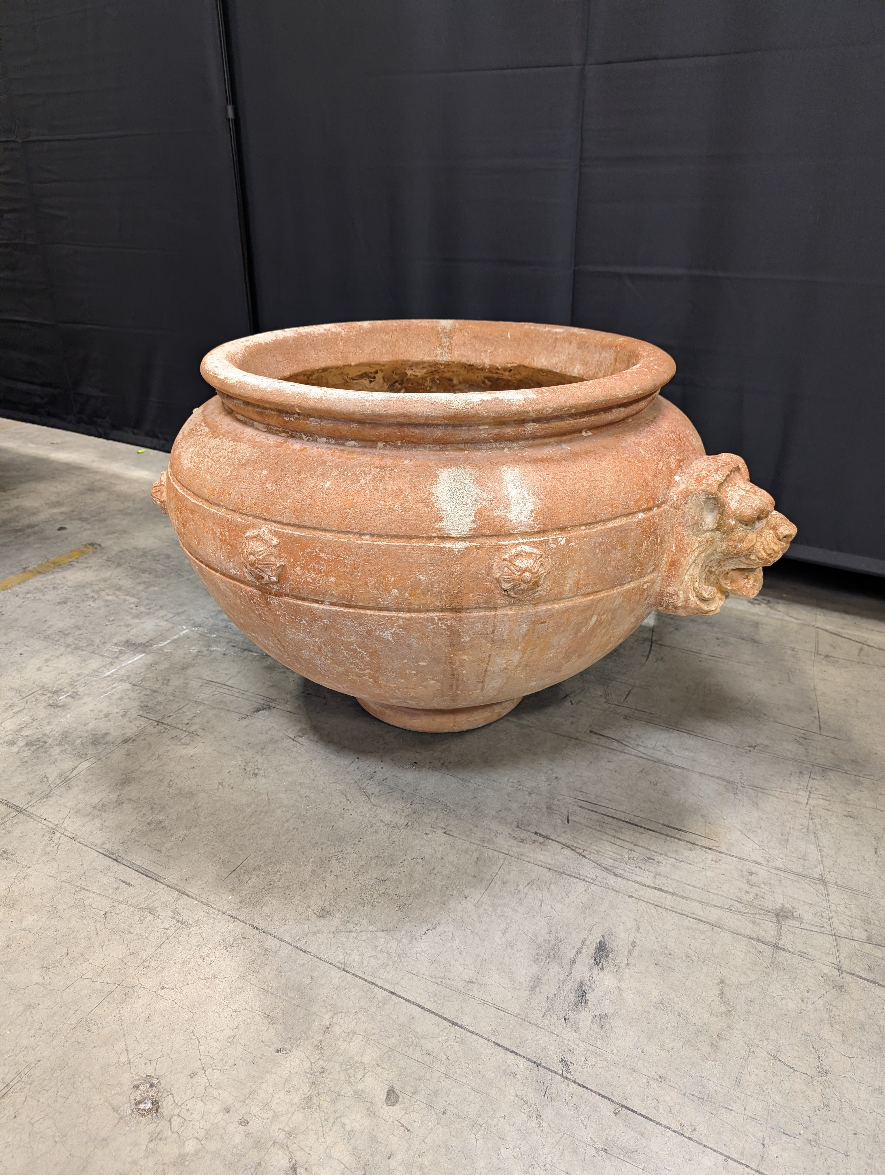 Ornate Terracotta-Style Planter with Lion Head Accents