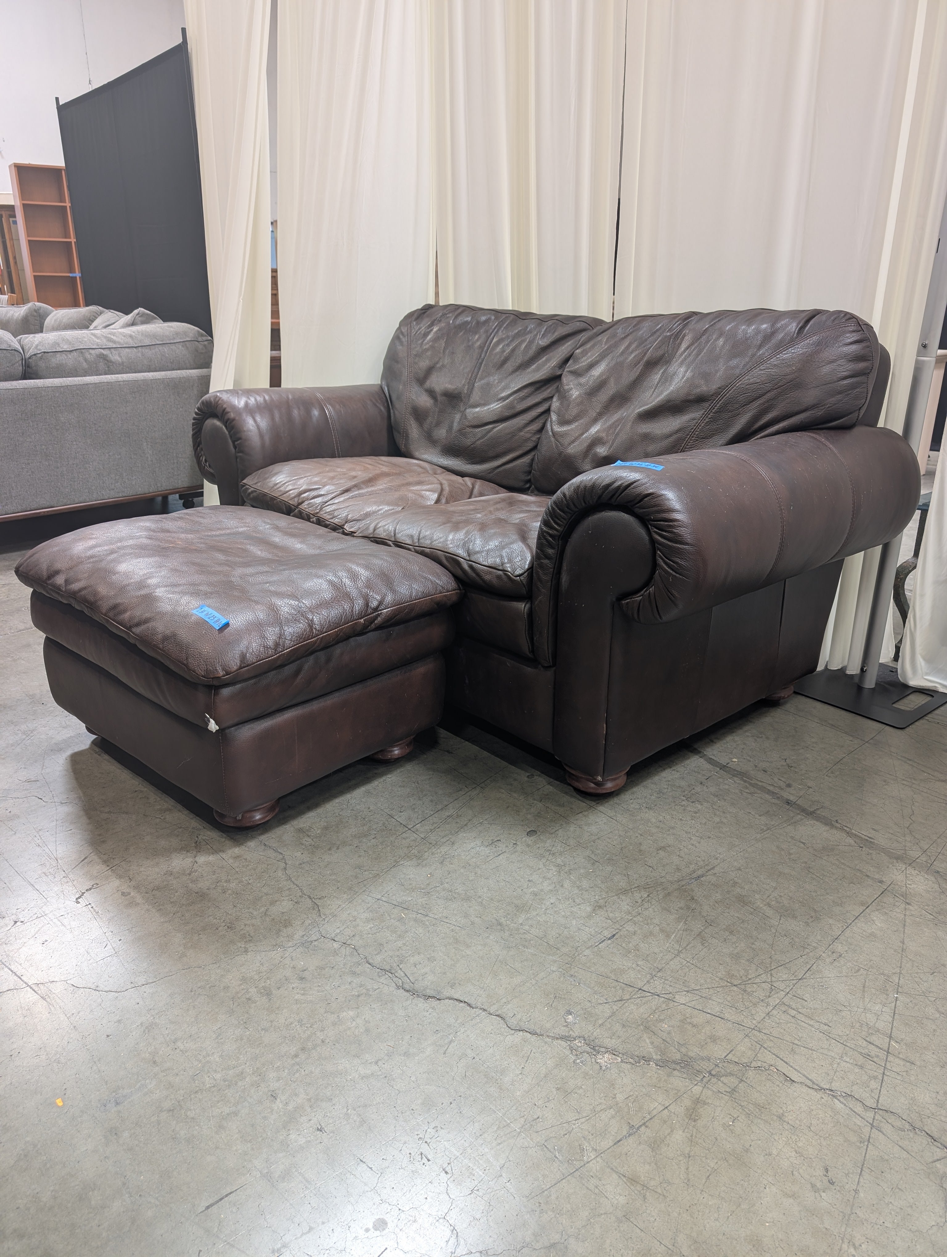 Dark Brown Leather Rolled Arm Couch with matching Ottoman